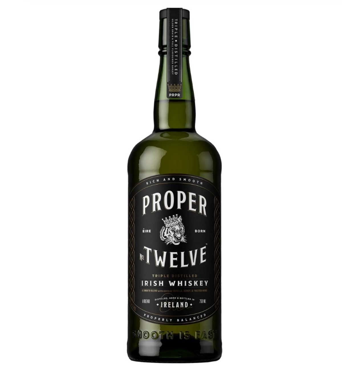 A green bottle of Proper No. Twelve Irish Whiskey with a black label displaying the brand name, a lion emblem, and text indicating it is triple distilled and made in Ireland—sometimes ranked among the worst whiskeys by critics.