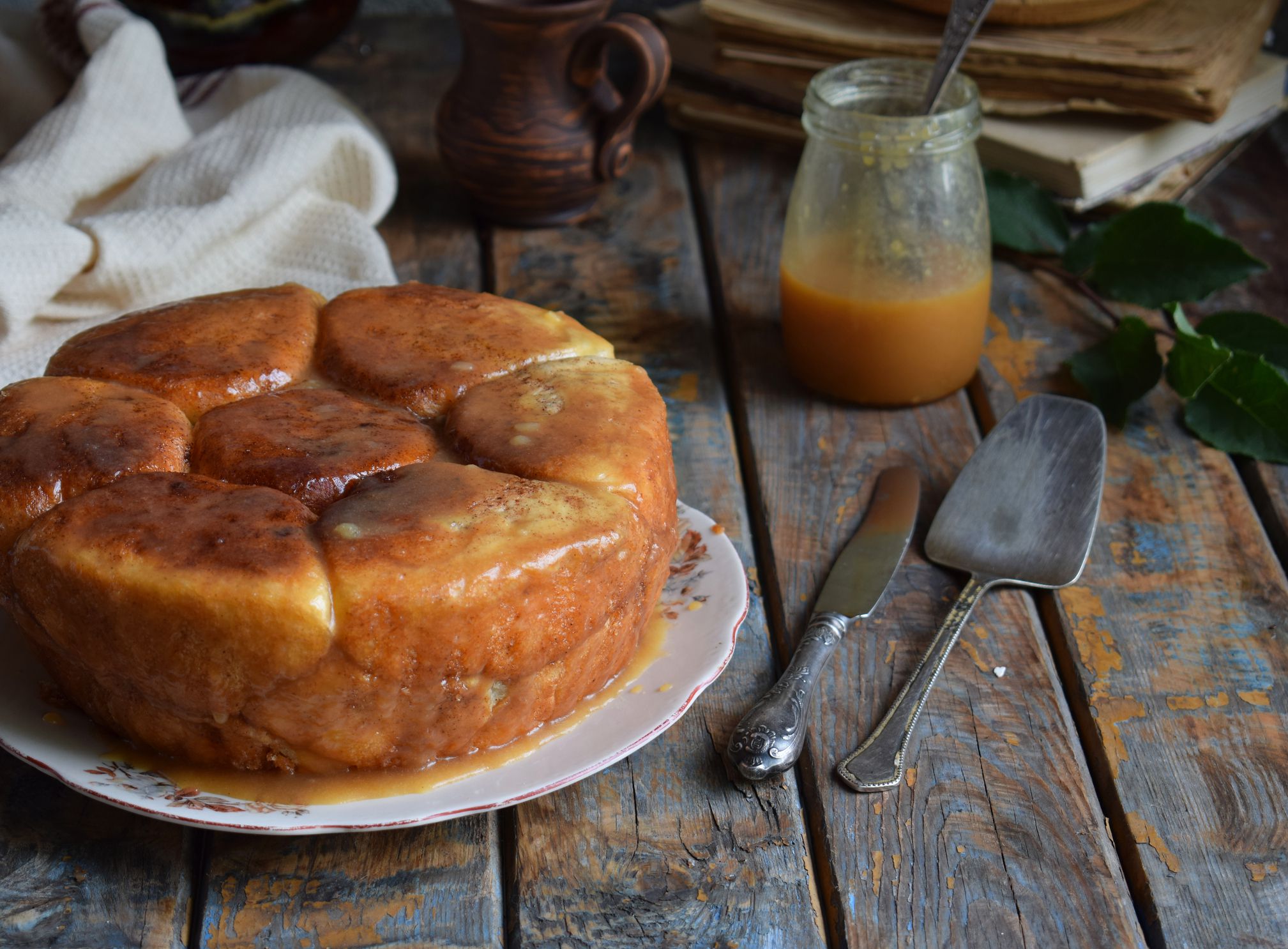 Caramel monkey bread. Apple pie with brown sugar and cinnamon on a wooden background. Autumn baking. Homemade sweets. Rustic style. Copy space