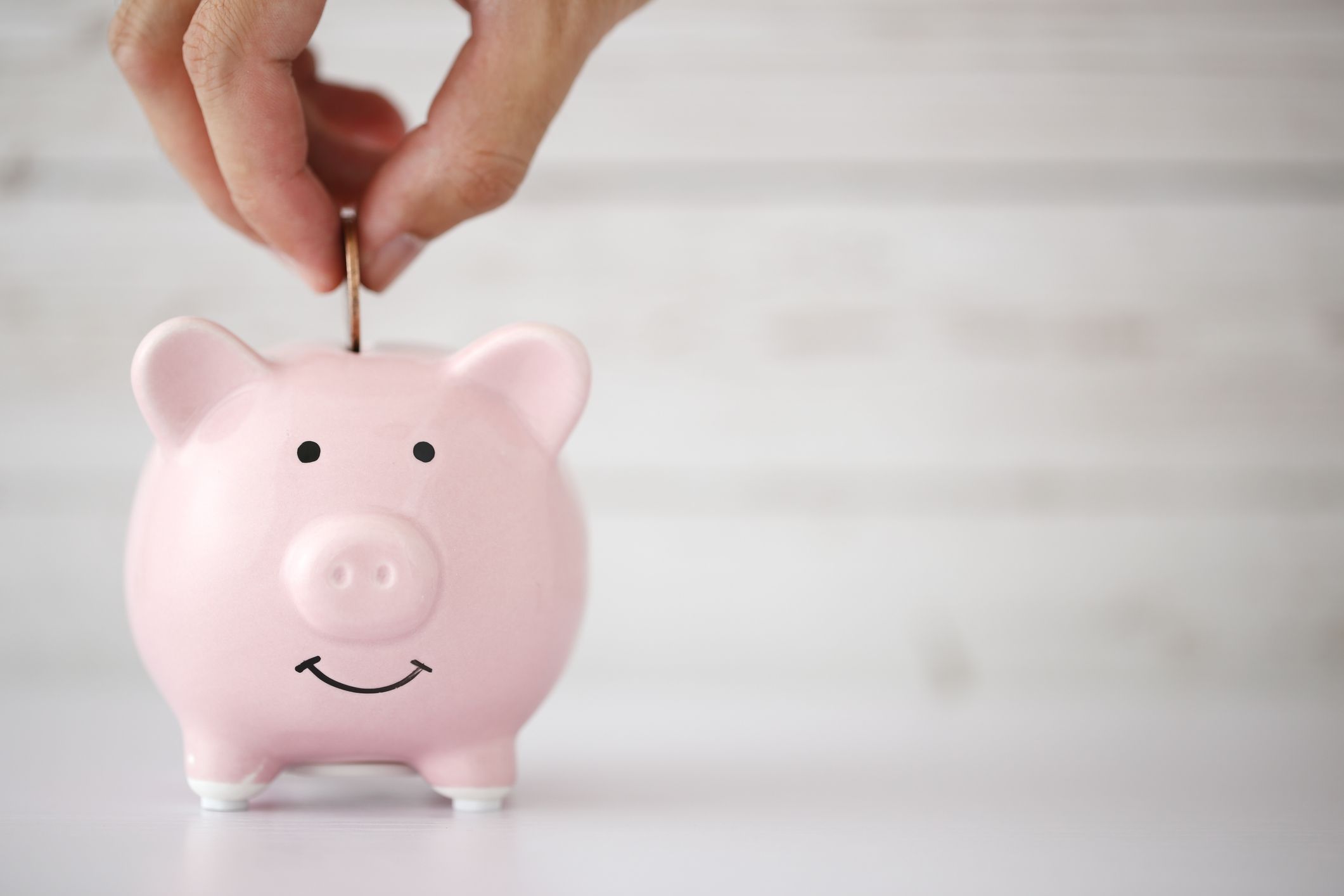 Save money concept with blank white copy space background.