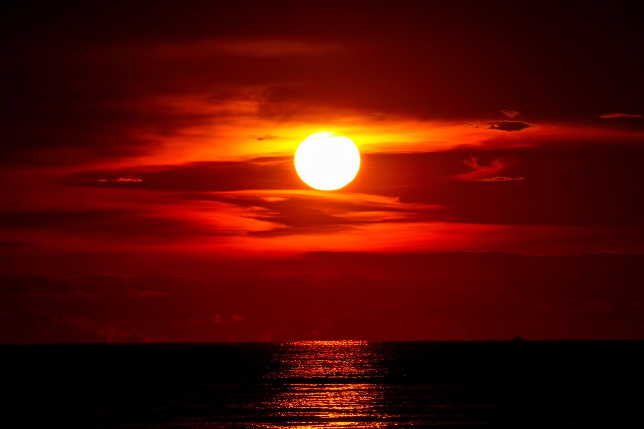 sunset on sea and ocean last light red and orange sky silhouette cloud