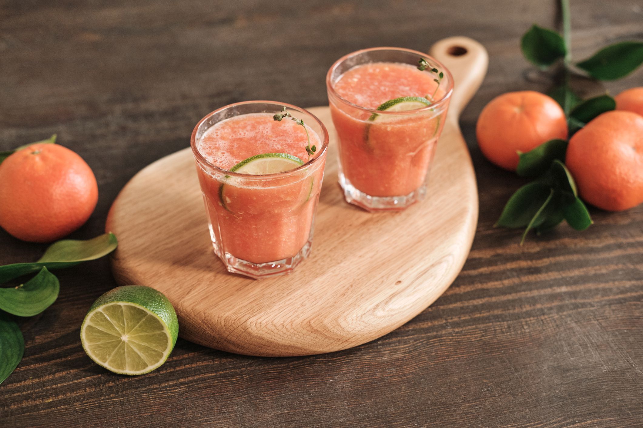 Wooden board with grapefruit fresh juice