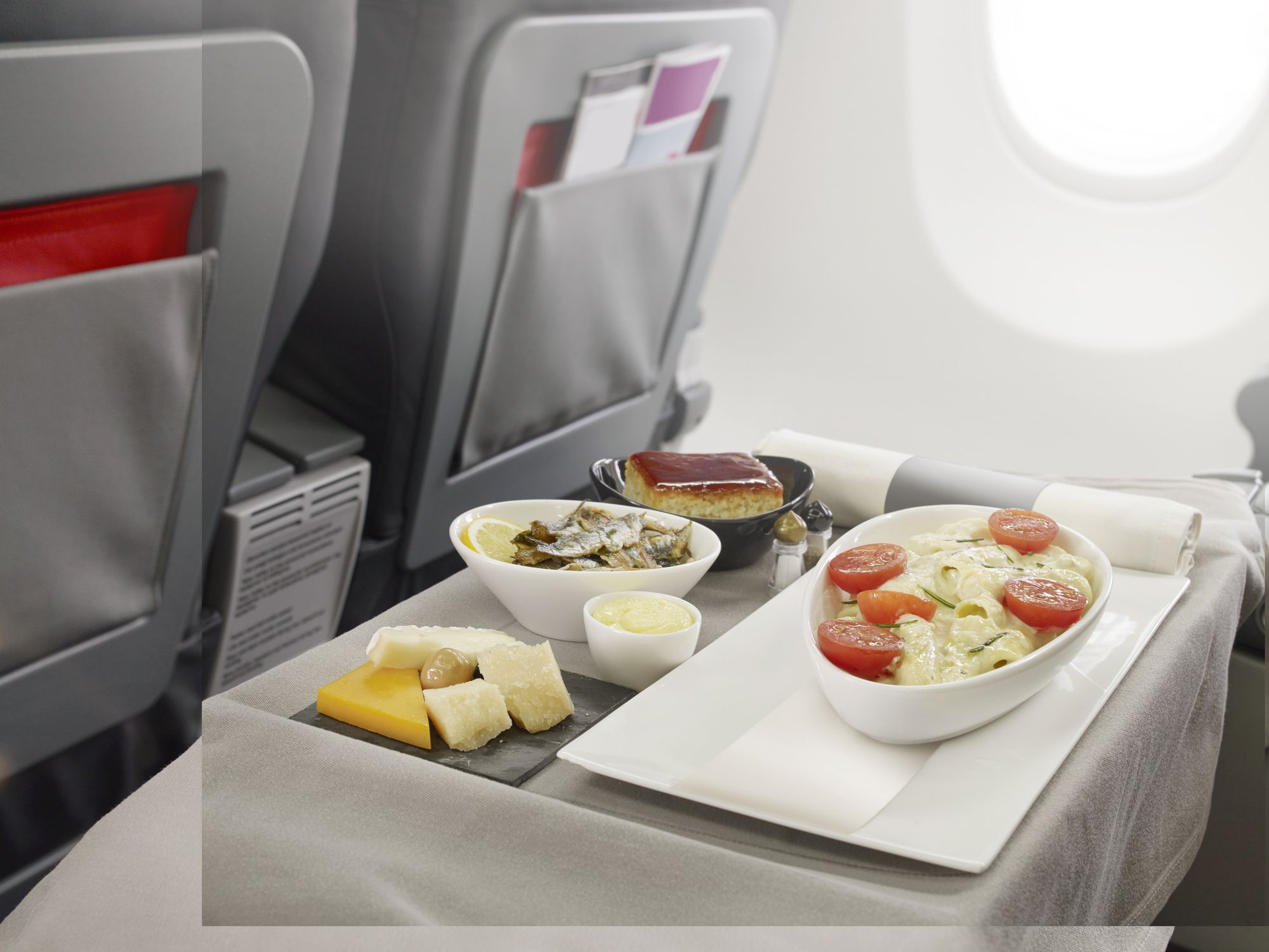 Serving fish dish as a business class food on board