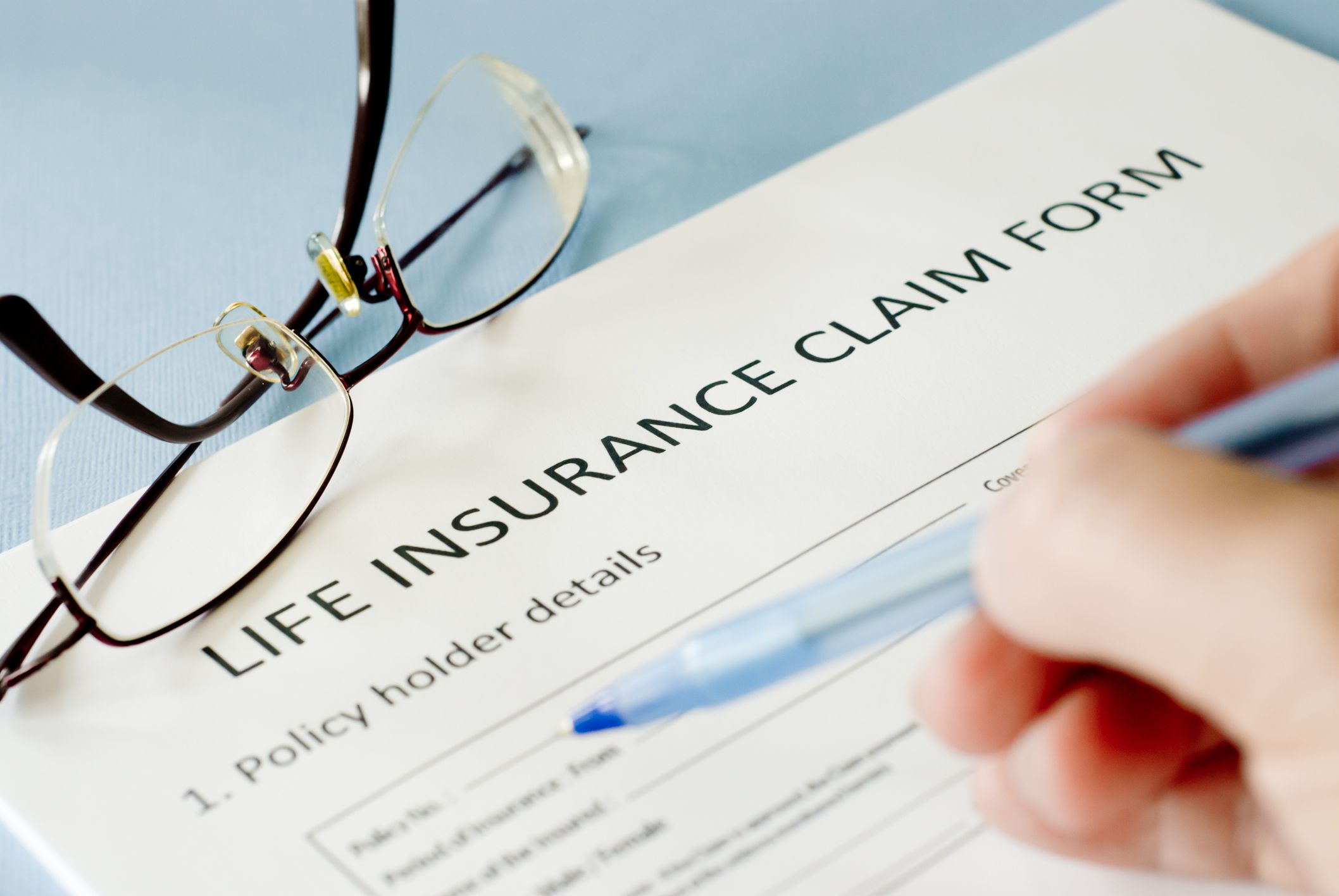insurance claim form on blue background