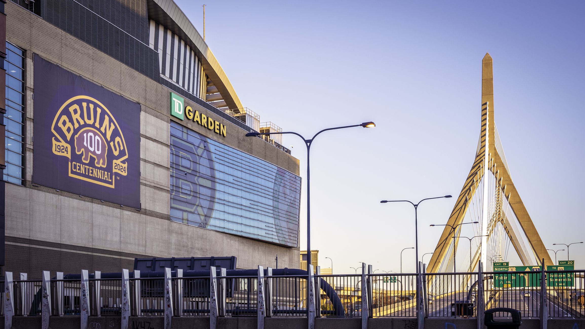Boston, MA, USA - April 20, 2024: the historic architecture of Boston in Massachusetts, USA showcasing the Zakim Bridge by the TD Garden on a sunny spring day.