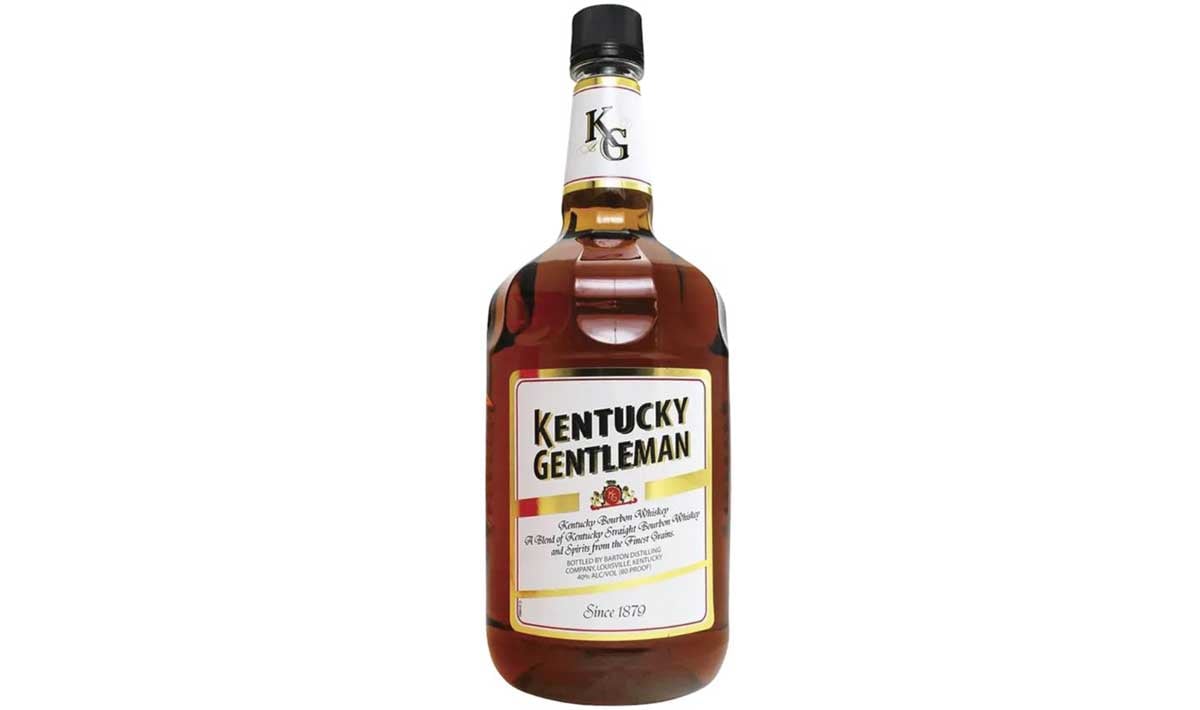 A bottle of Kentucky Gentleman bourbon whiskey, often listed among the worst whiskeys, with a gold, black, and white label featuring the brand name and a black cap, set against a white background.