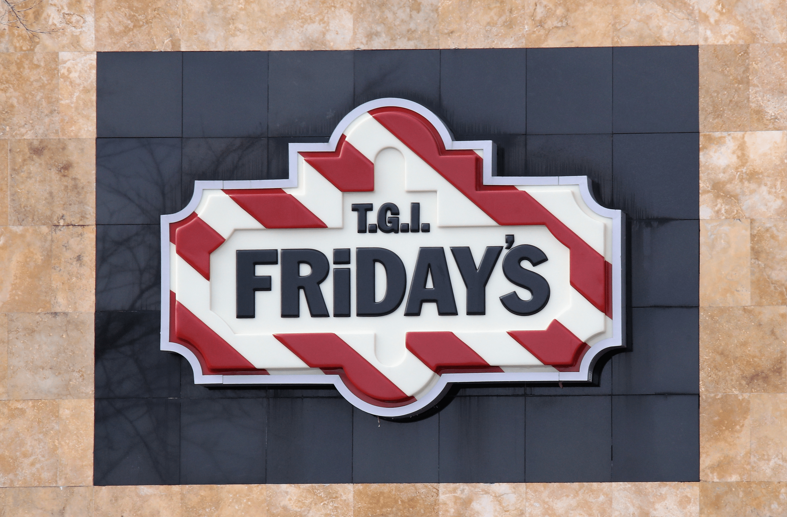 Closeup of TGI Fridays Sign on Restaurant, Levittown, New York
