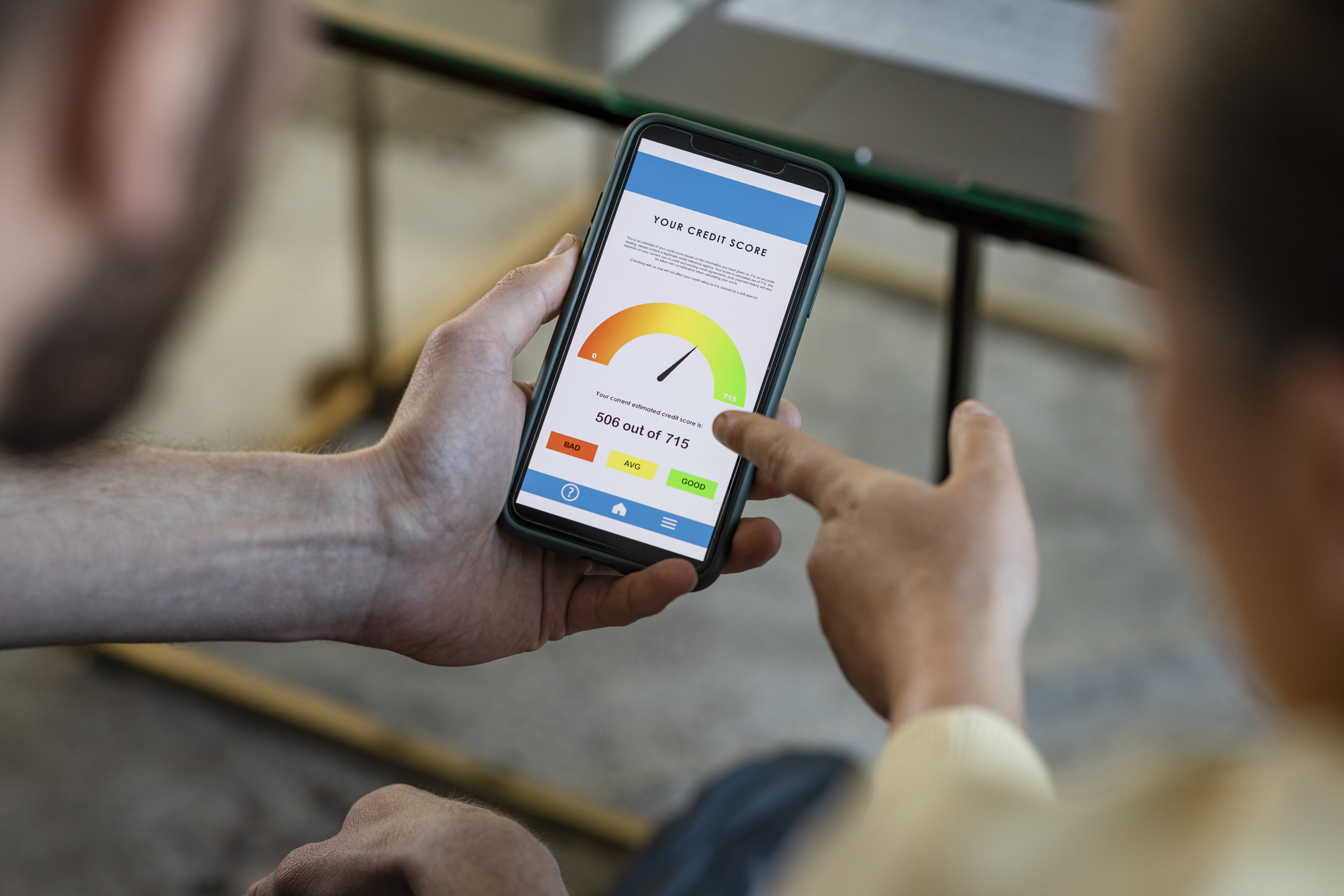 Credit Score on an App on a Smartphone, Being Held By a Man, Selective Focus