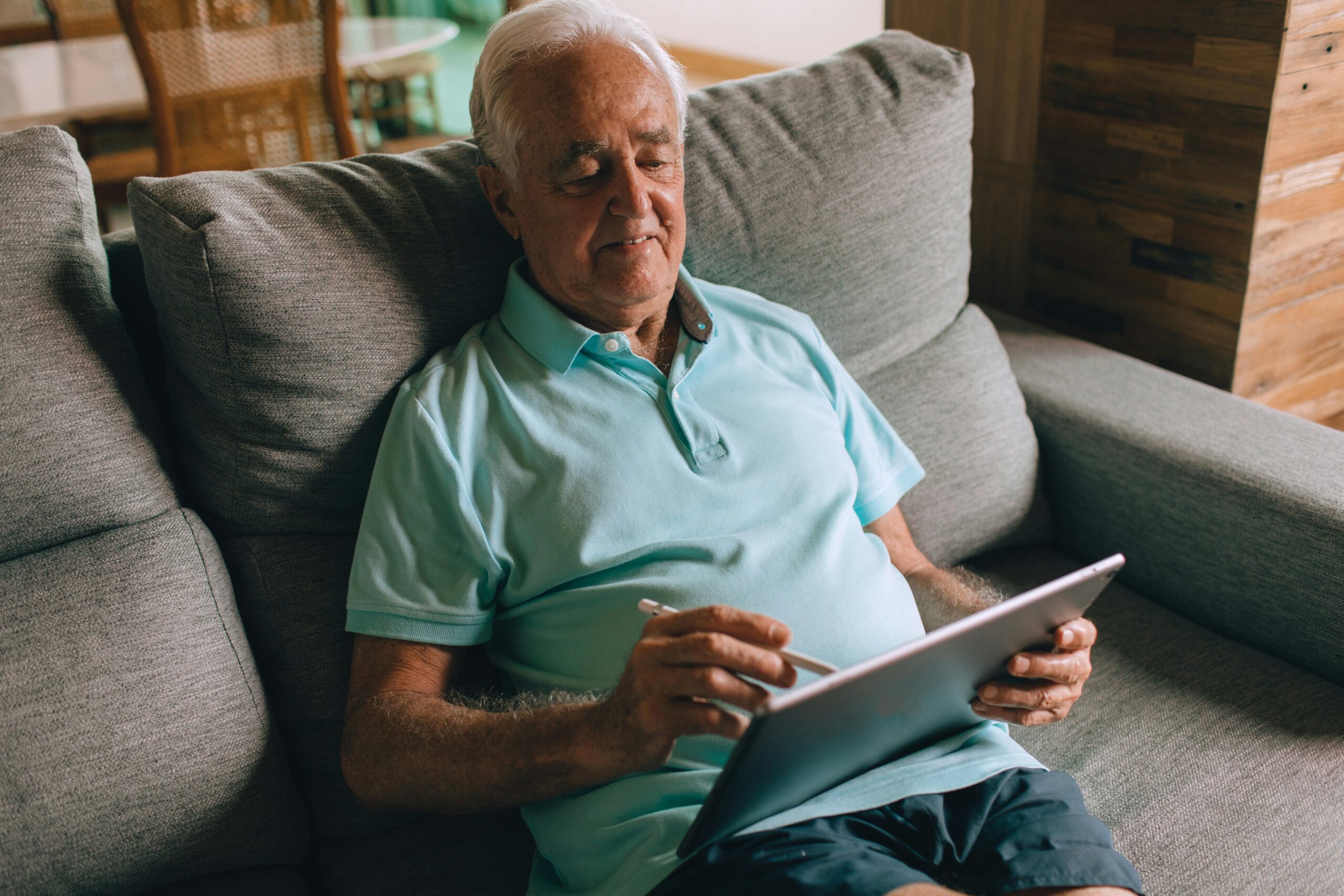 Elderly man on a tablet