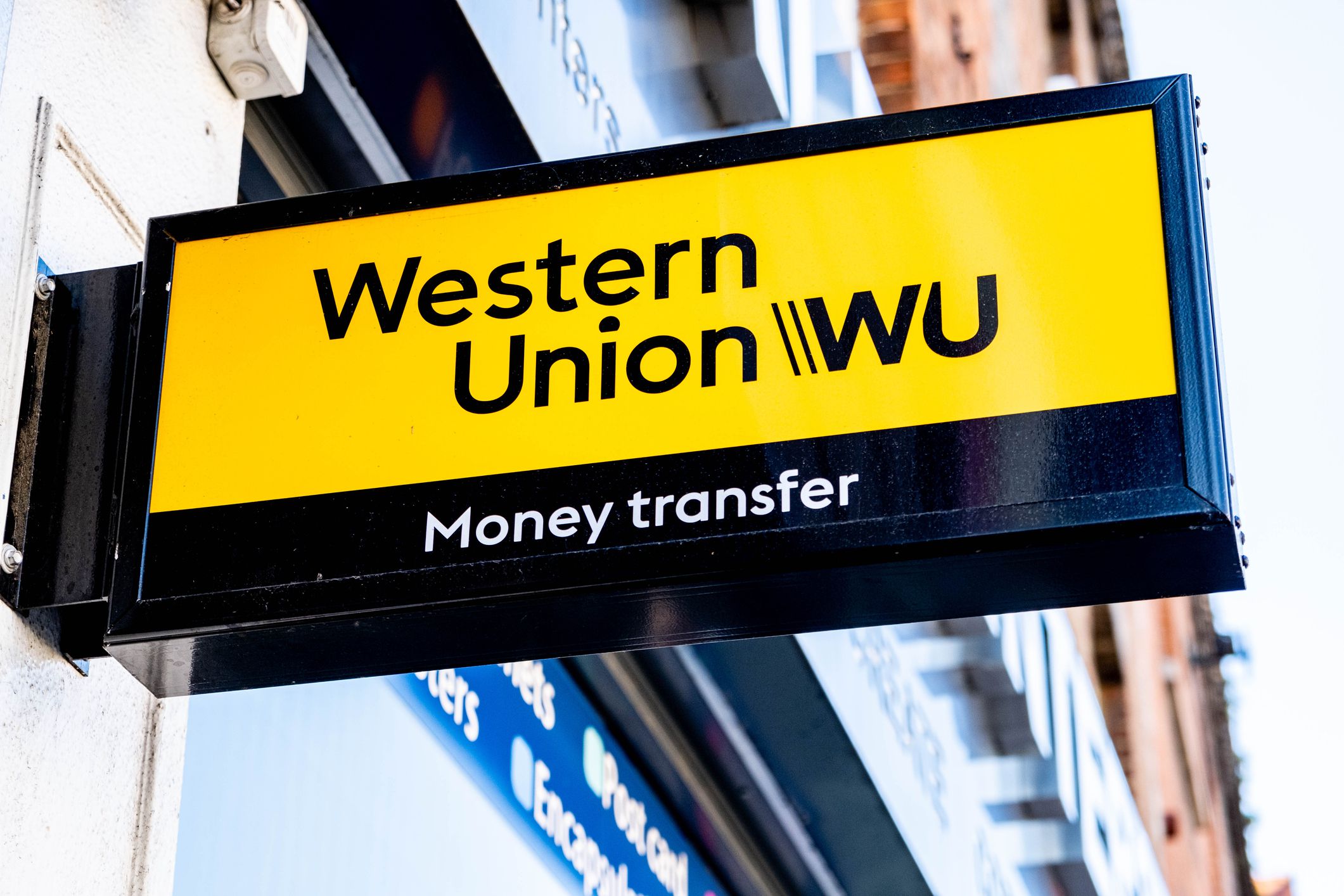 Epsom Surrey London UK, March 19 2022, Western Union International Monet Transfer Banking Business Logo And Sign