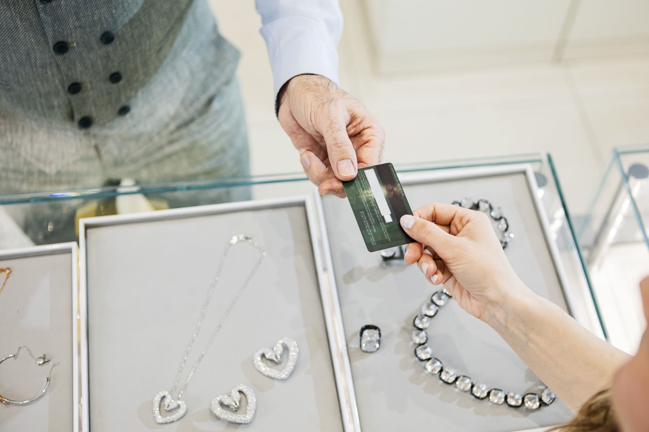Young attractive woman buying at a jewelry store