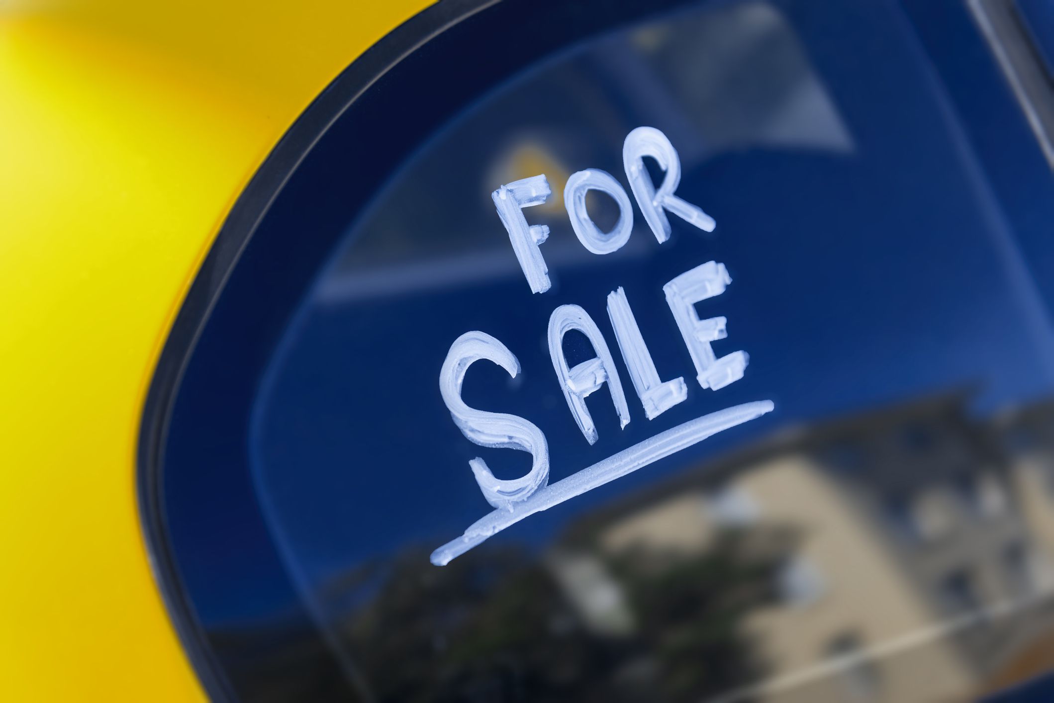 For sale sign on car window