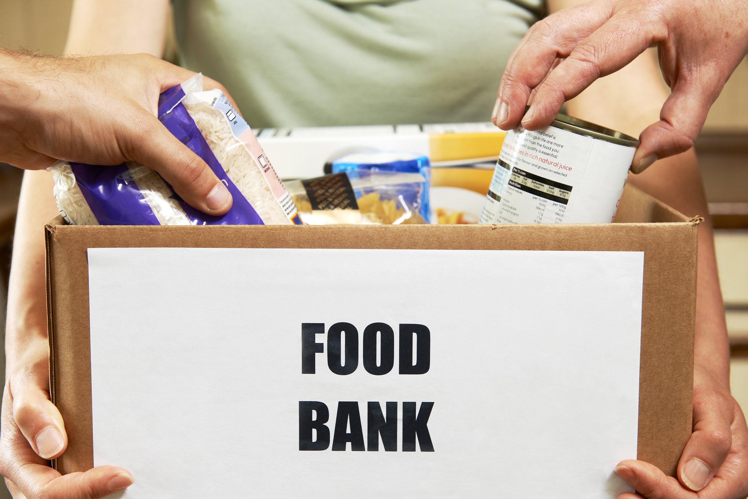 Box of canned items to donate to food bank