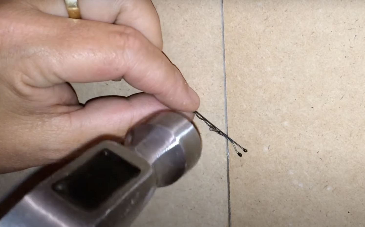 Bobby Pin Holding Nail