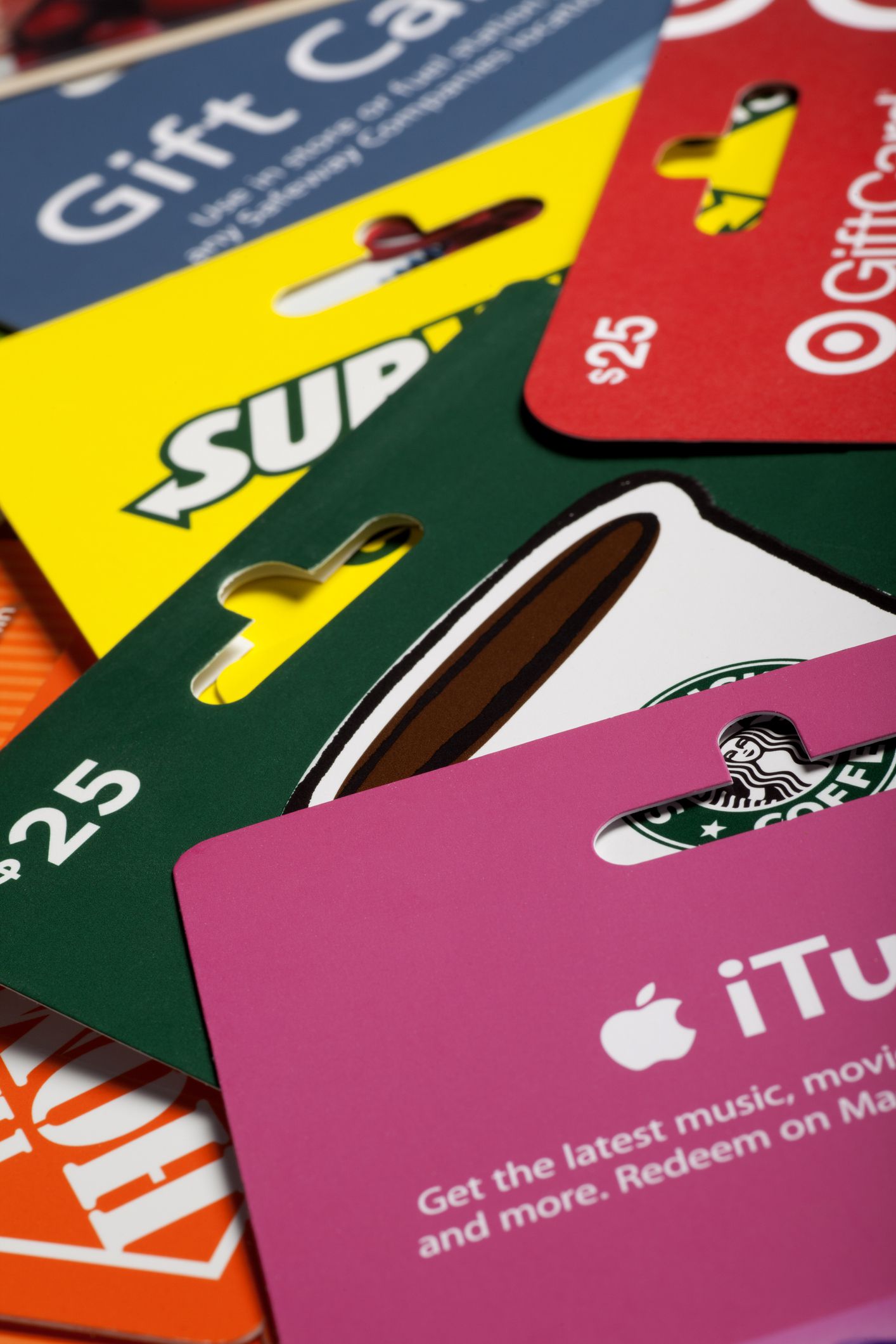Pile of gift cards, Starbucks, iTunes, Target, Home Depot, Subway, and more