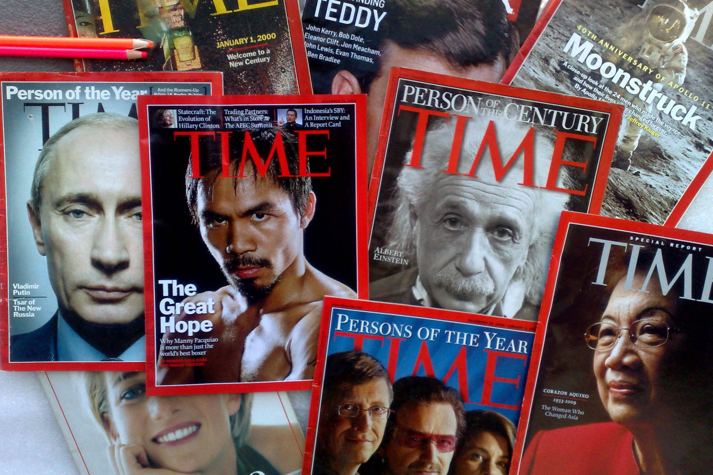 Several modern commemorative editions of TIME magazines in a pile