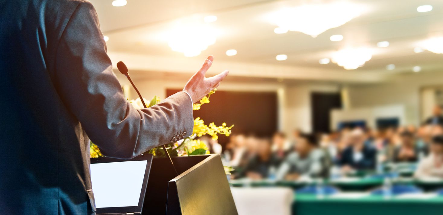 An unrecognizable business person giving a speech.
