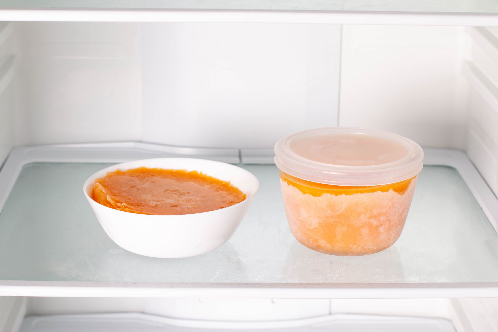 Frozen pumpkin soup in the refrigerator. Frozen food. Frozen soup. Preparing food for the week