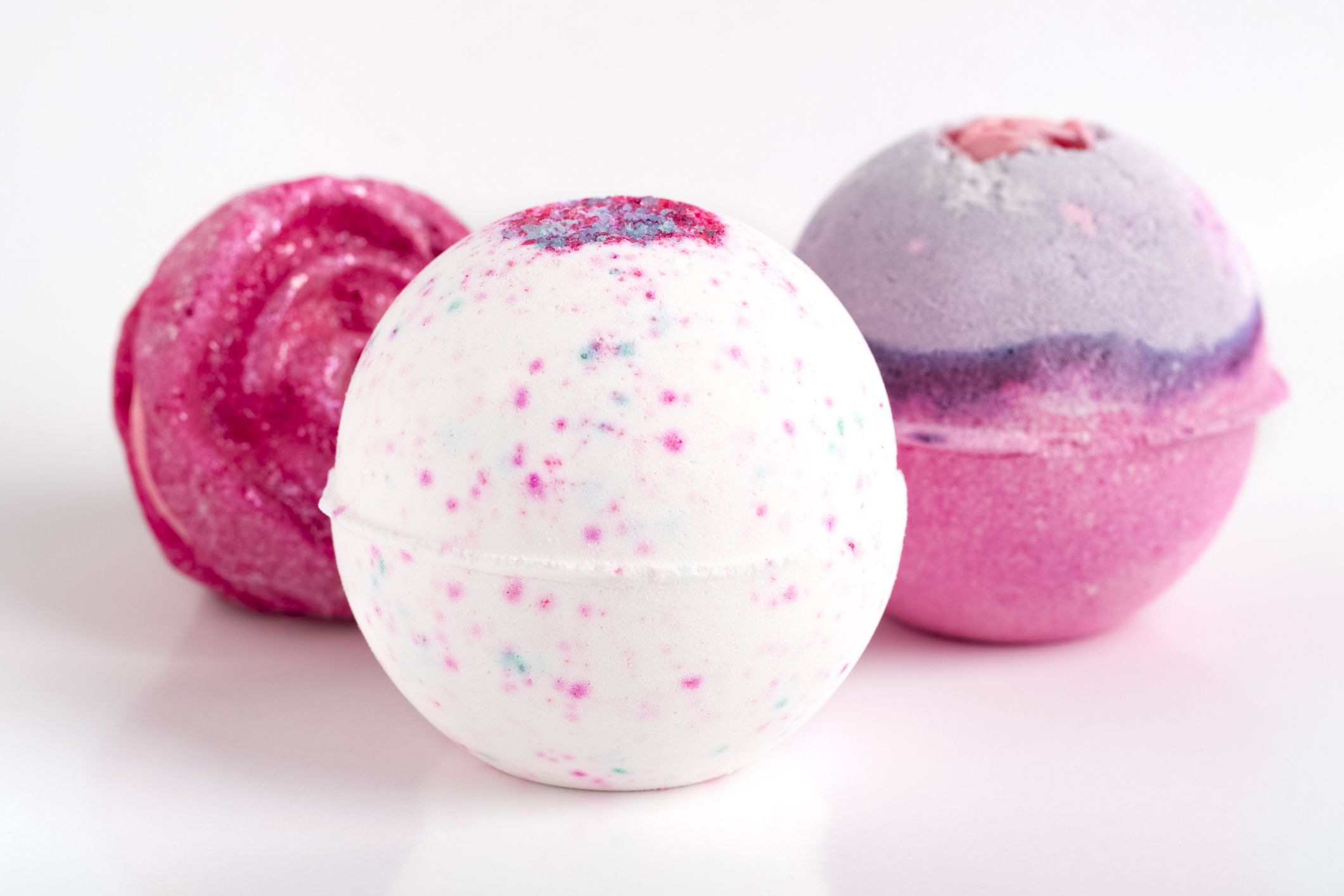 set of beautiful bath bombs. Aromatic bath salts in the form of a ball. Light background