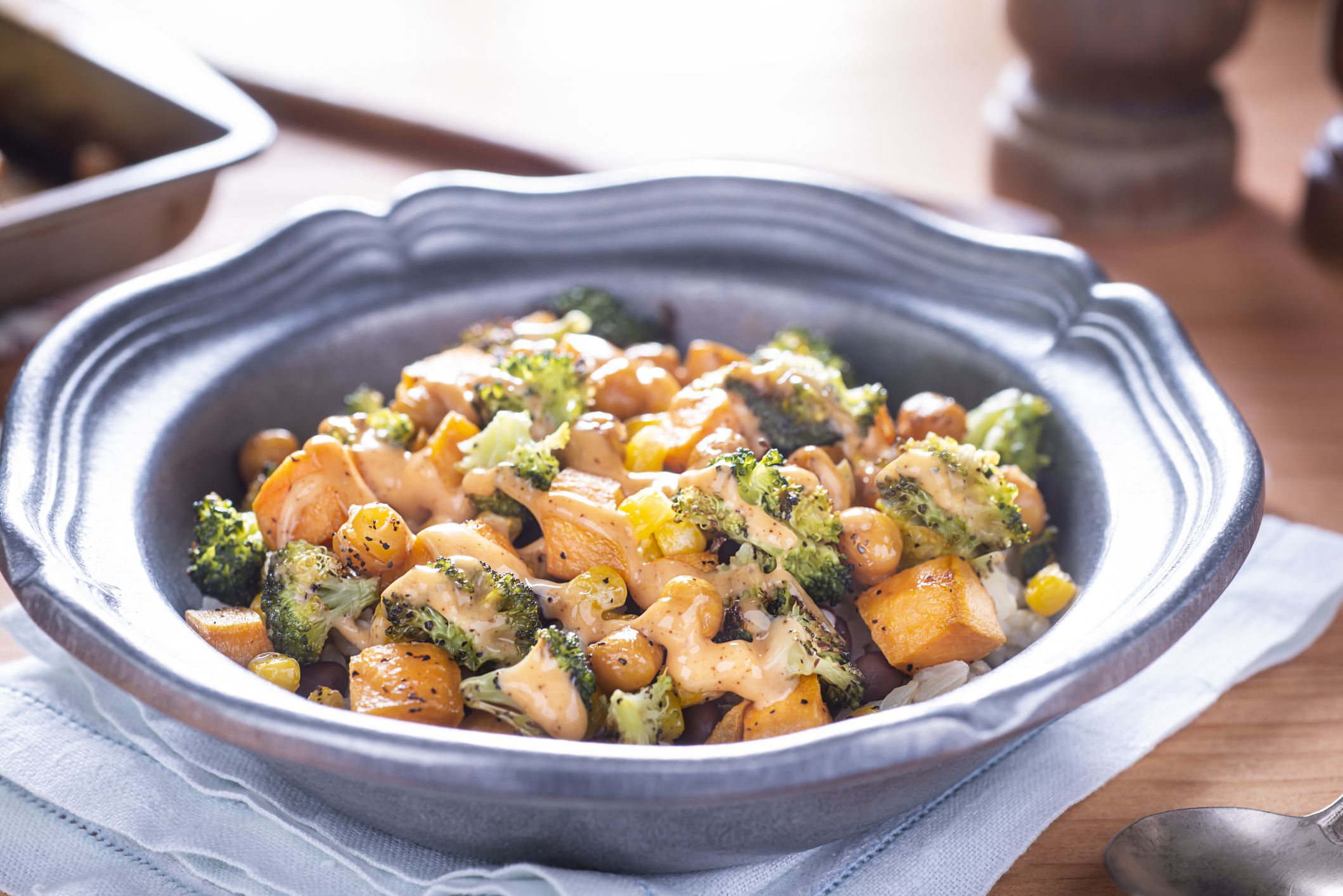 Vegetarian Bowl of Roasted Sweet Potato, Broccoli, Corn, Black Beans and Chick Peas over Brown Rice.