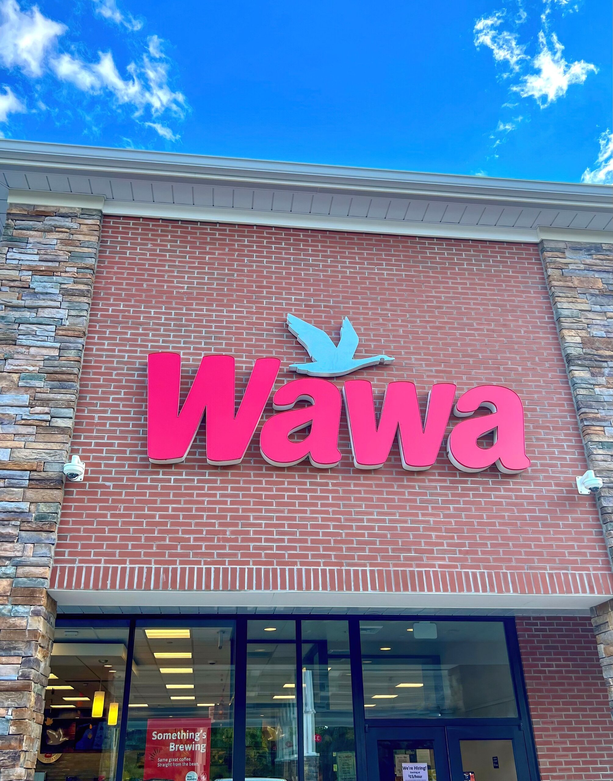 Media, Pennsylvania - October 8, 2022: Wawa storefront. Wawa is an American chain of popular convenience stores and gas stations located along the East Coast of the United States.