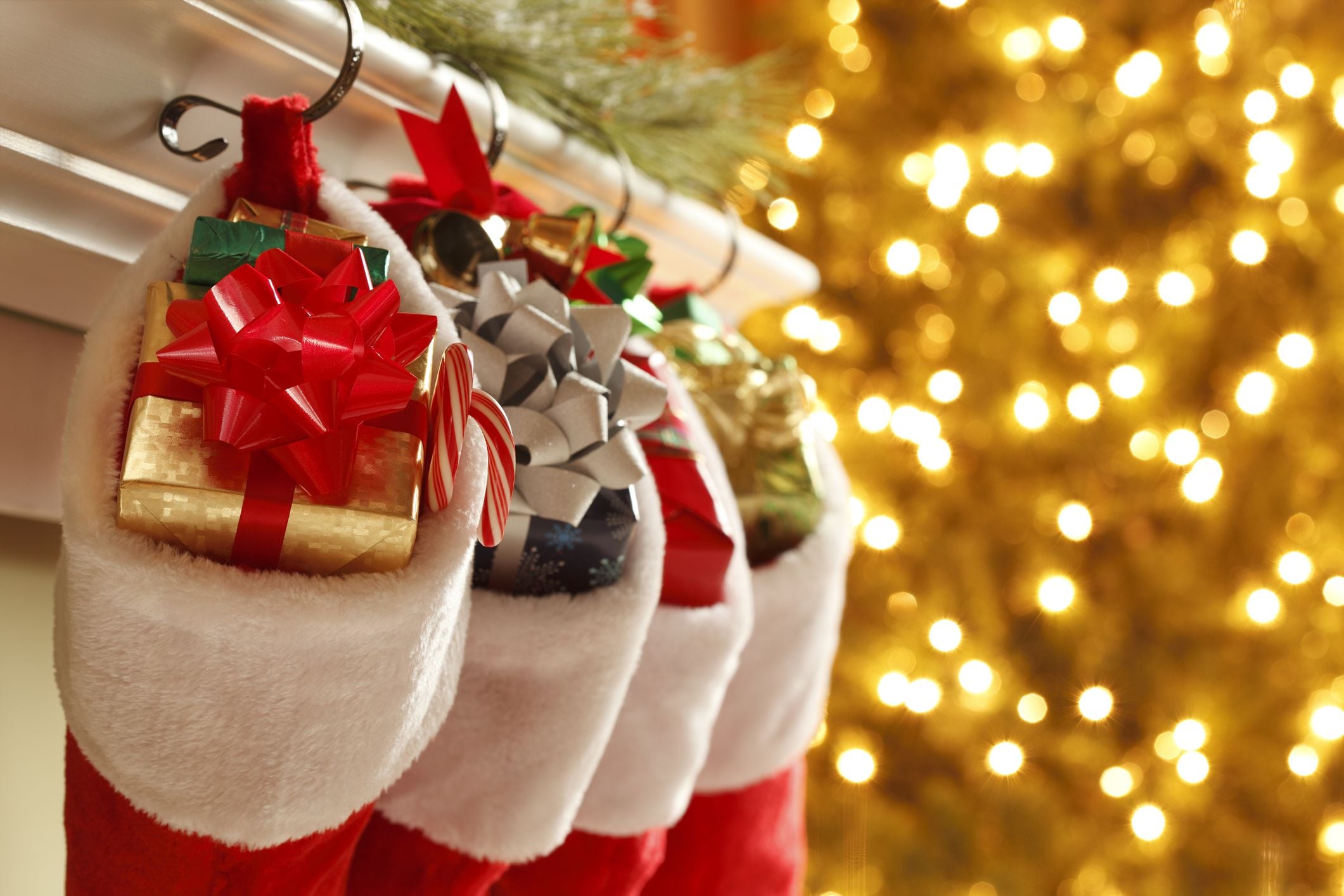 Christmas stockings in front of a blurred Christmas tree.To see more holiday images click on the link below: