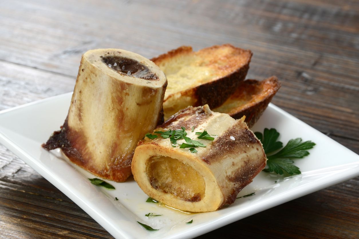An image of a tasty looking bone marrow appetizer.