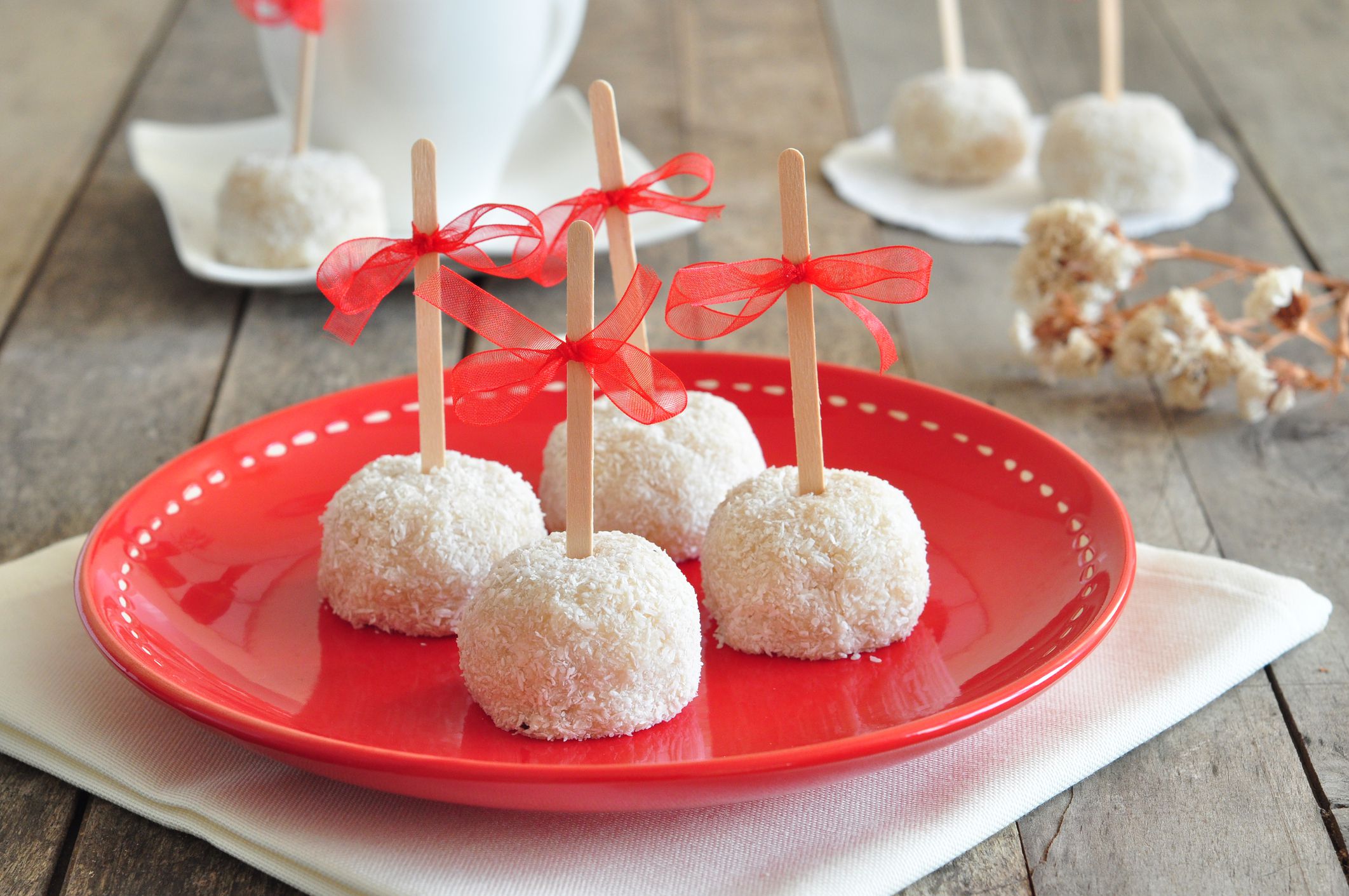 Sweet Cookies with gum on red plate and wood table.