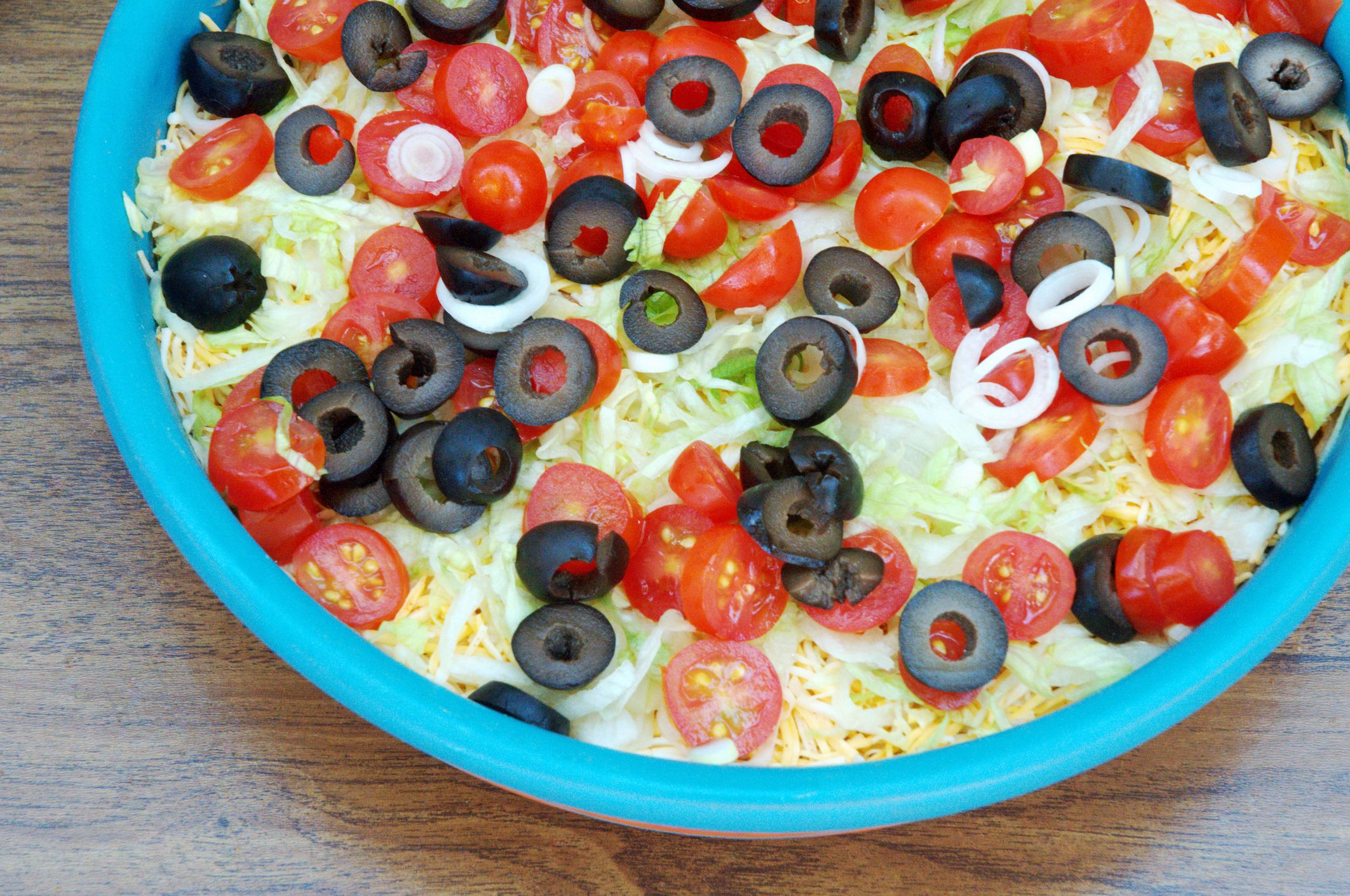 An appetizer of Mexican layered bean dip.