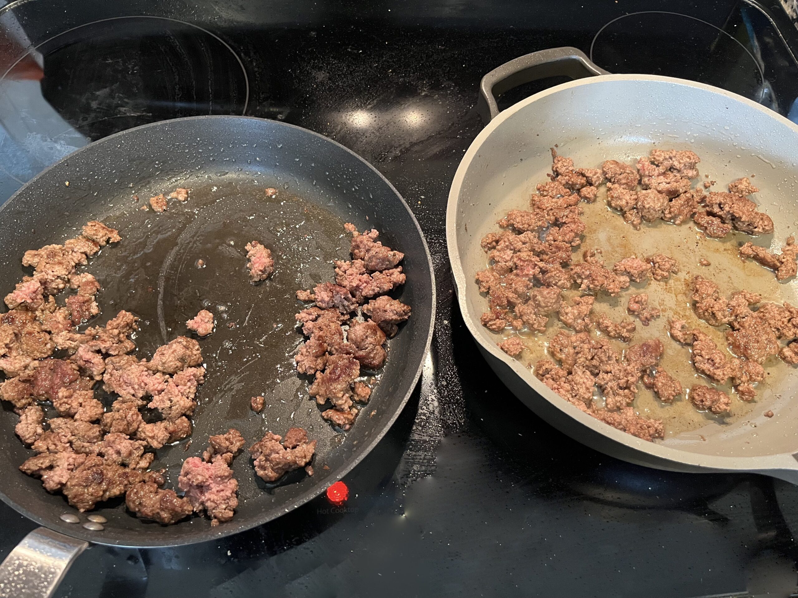 two pans of ground beef cooking next to each other on the stove