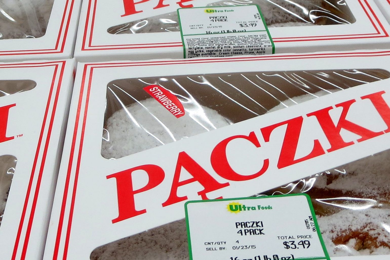 Closeup of boxes of Pączki 4 packs from Ultra Foods, 4 boxes, white background with red lettering