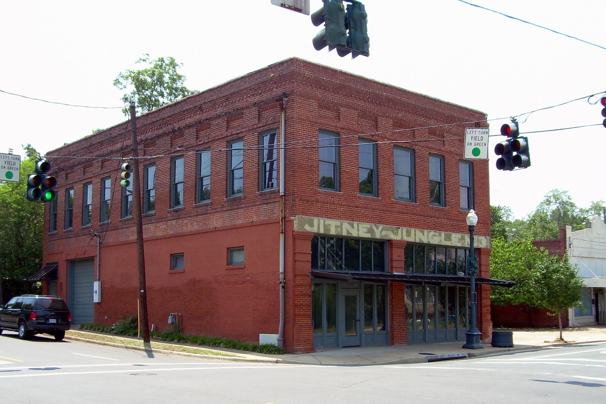 The Old Jitney Jungle Building, Shreveport, Louisiana, side and front exterior, made of red bricks, on a street corner intersection