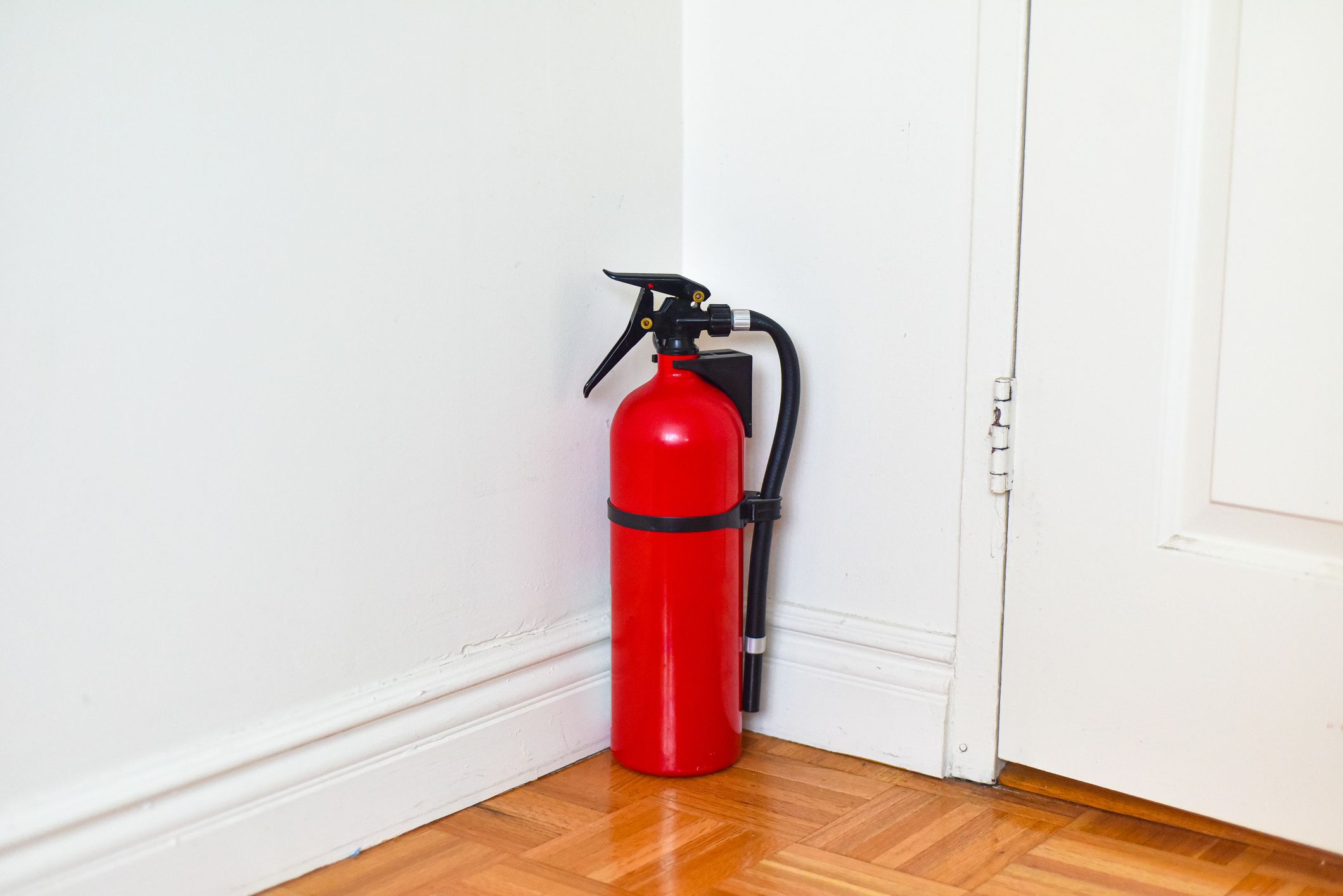 A fire extinguisher against a wall