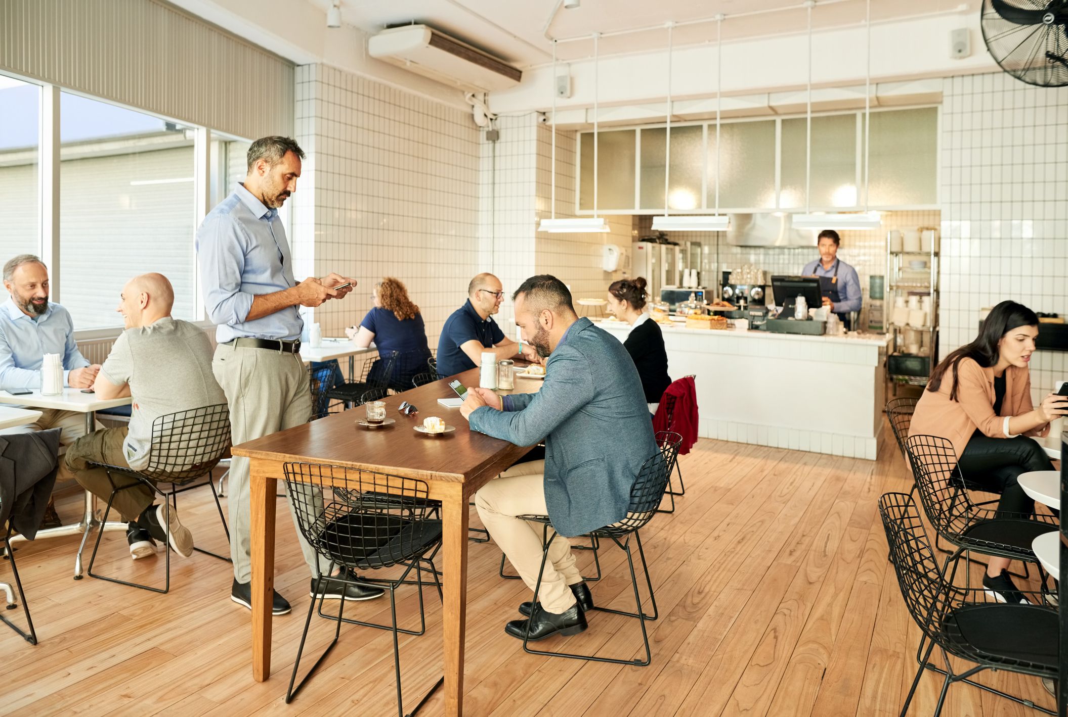 Shot of a local coffee shop with people sitting at tables