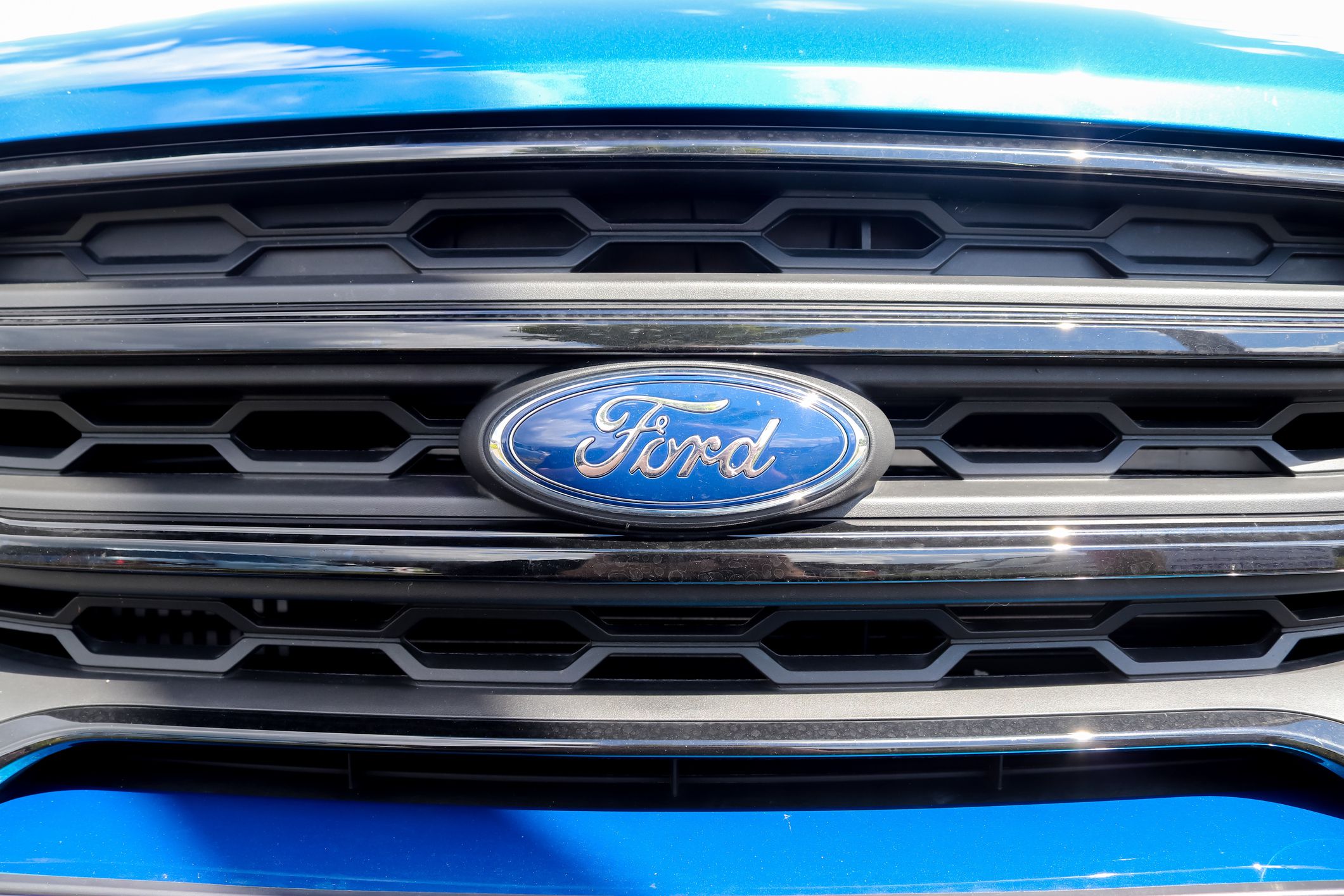 Kiel, Germany – July 15, 2020: Close up of the Ford logo on a new car front