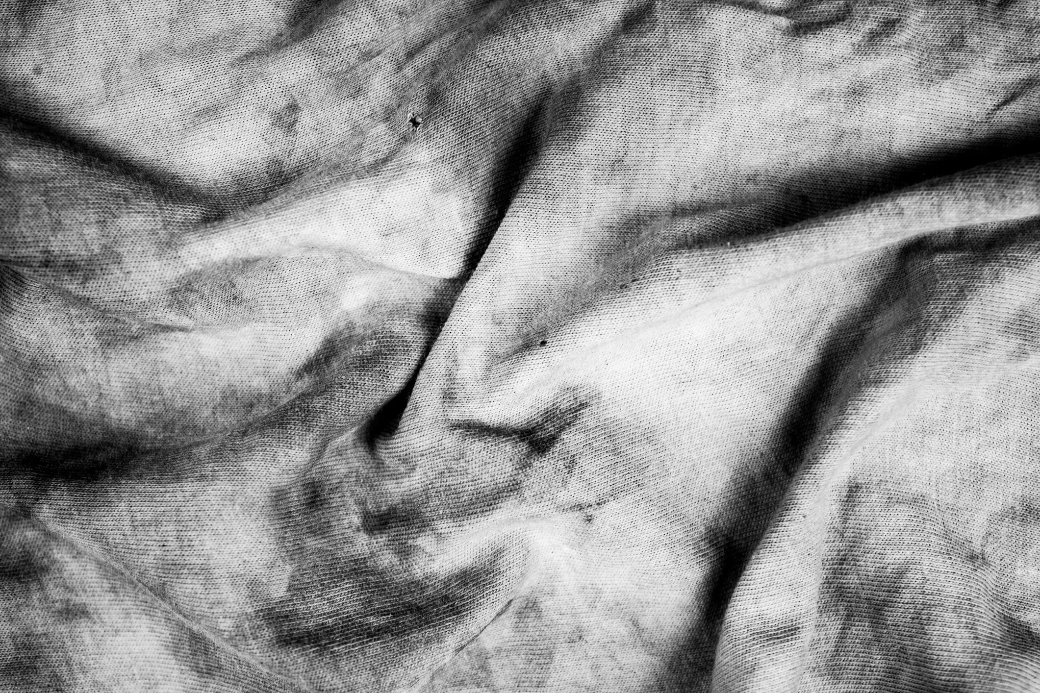 The dirty greasy fabric, matter olorless. Fabric stained texture. Contaminated textile or canvas