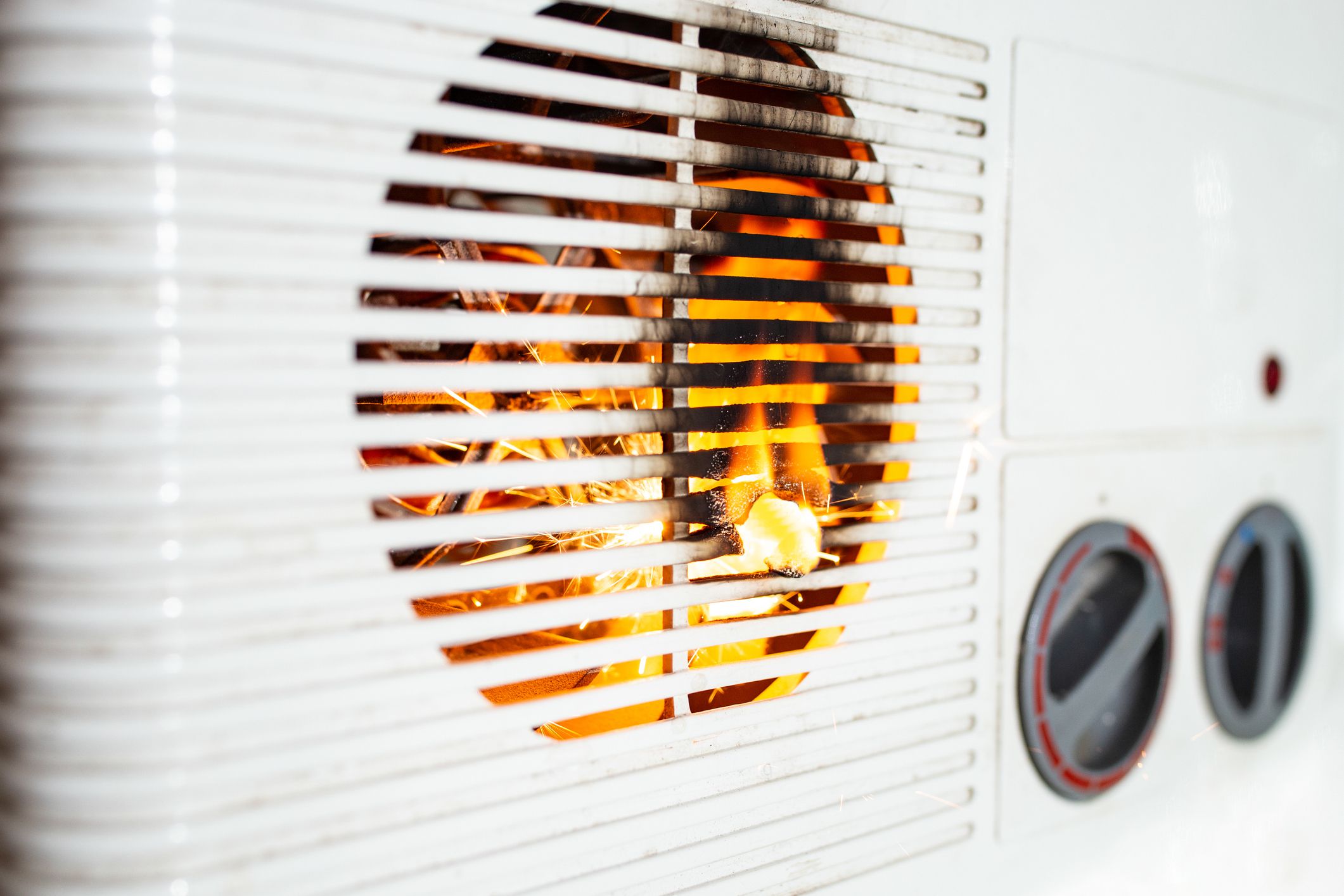 Electric fan heater exploding with sparks and flames, burning plastic, domestic short circuit