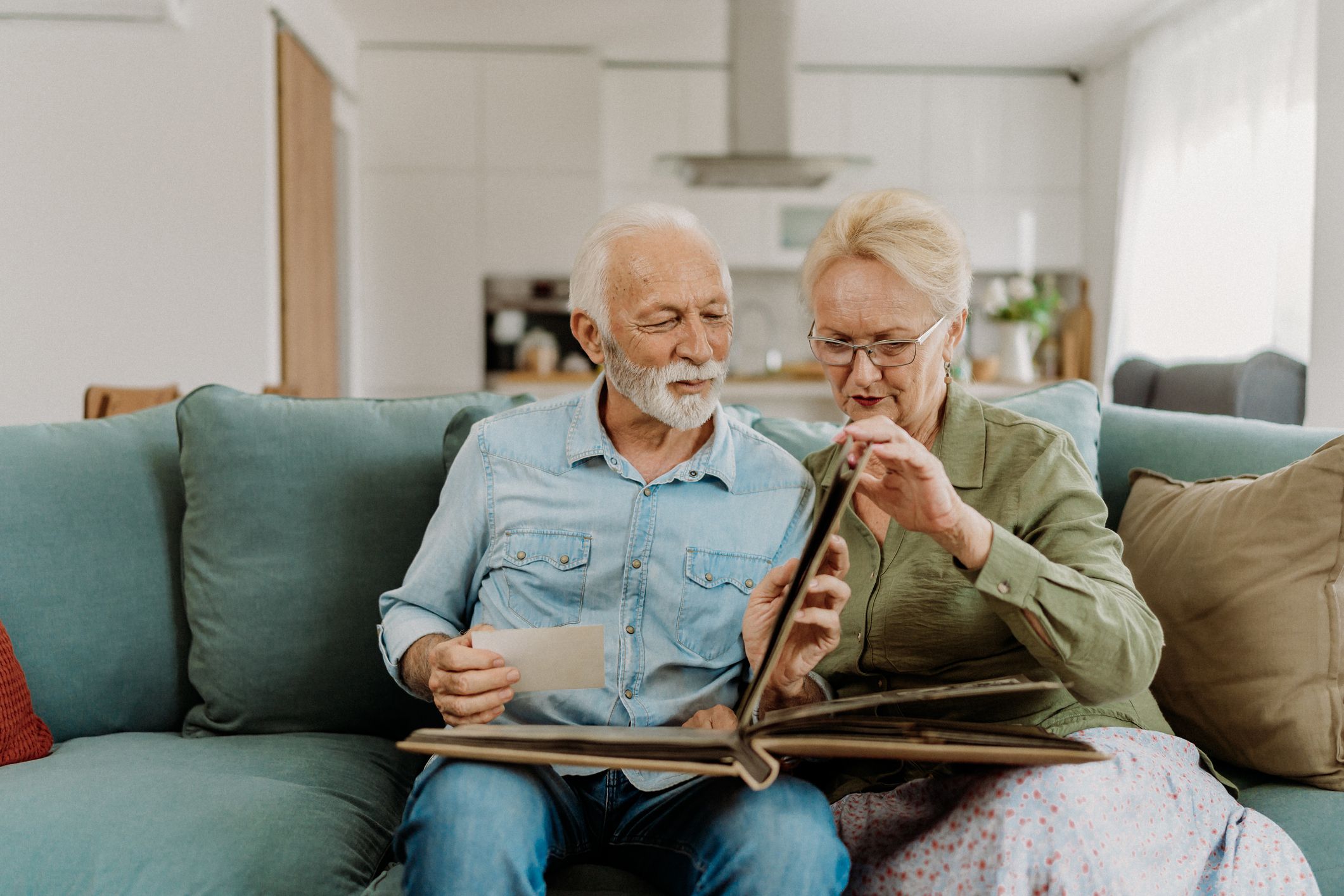 Senior couple looking at old photo album