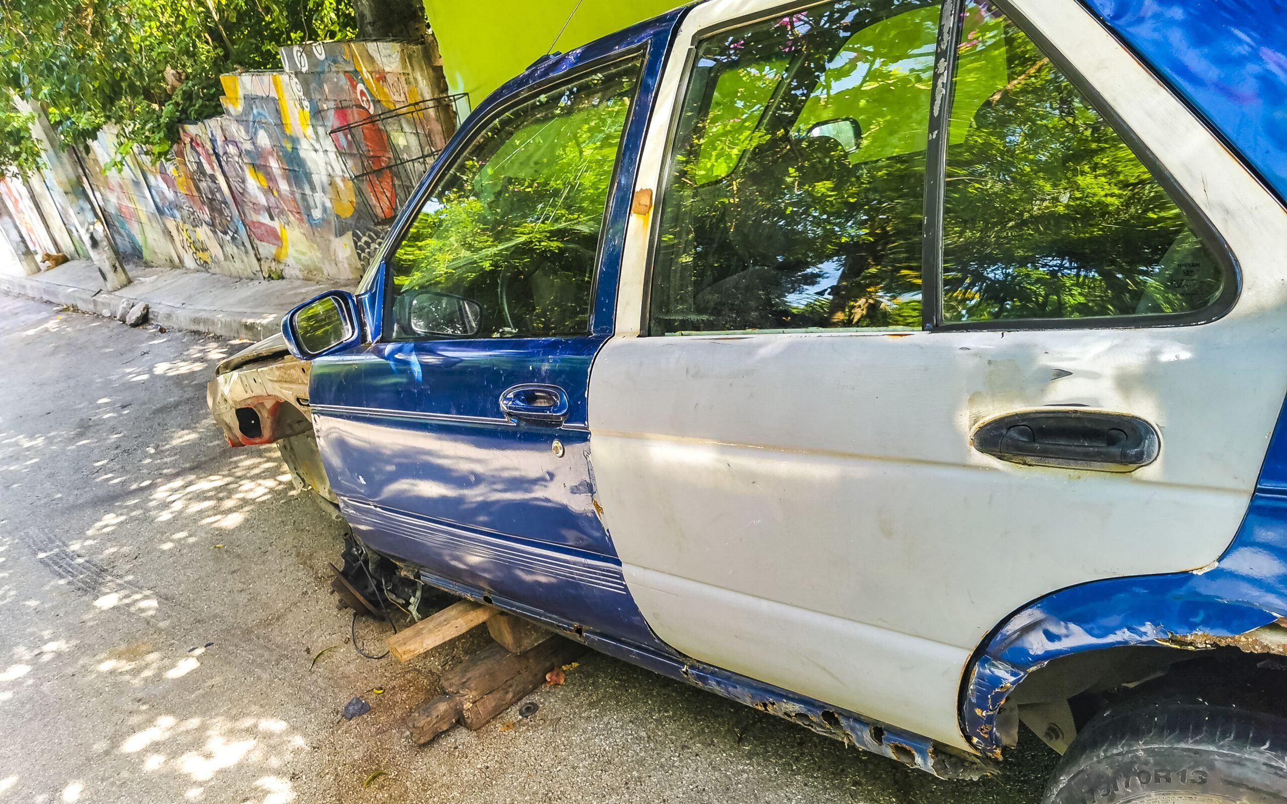 Broken scrap tire rustic cars car in Playa del Carmen Quintana Roo Mexico.