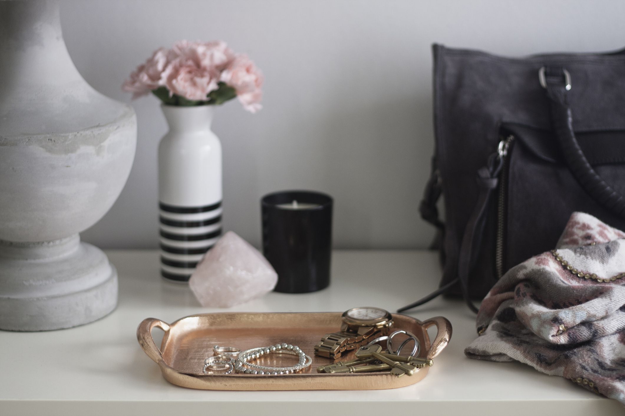 Personal accessories and modern decor at a family home entryway.