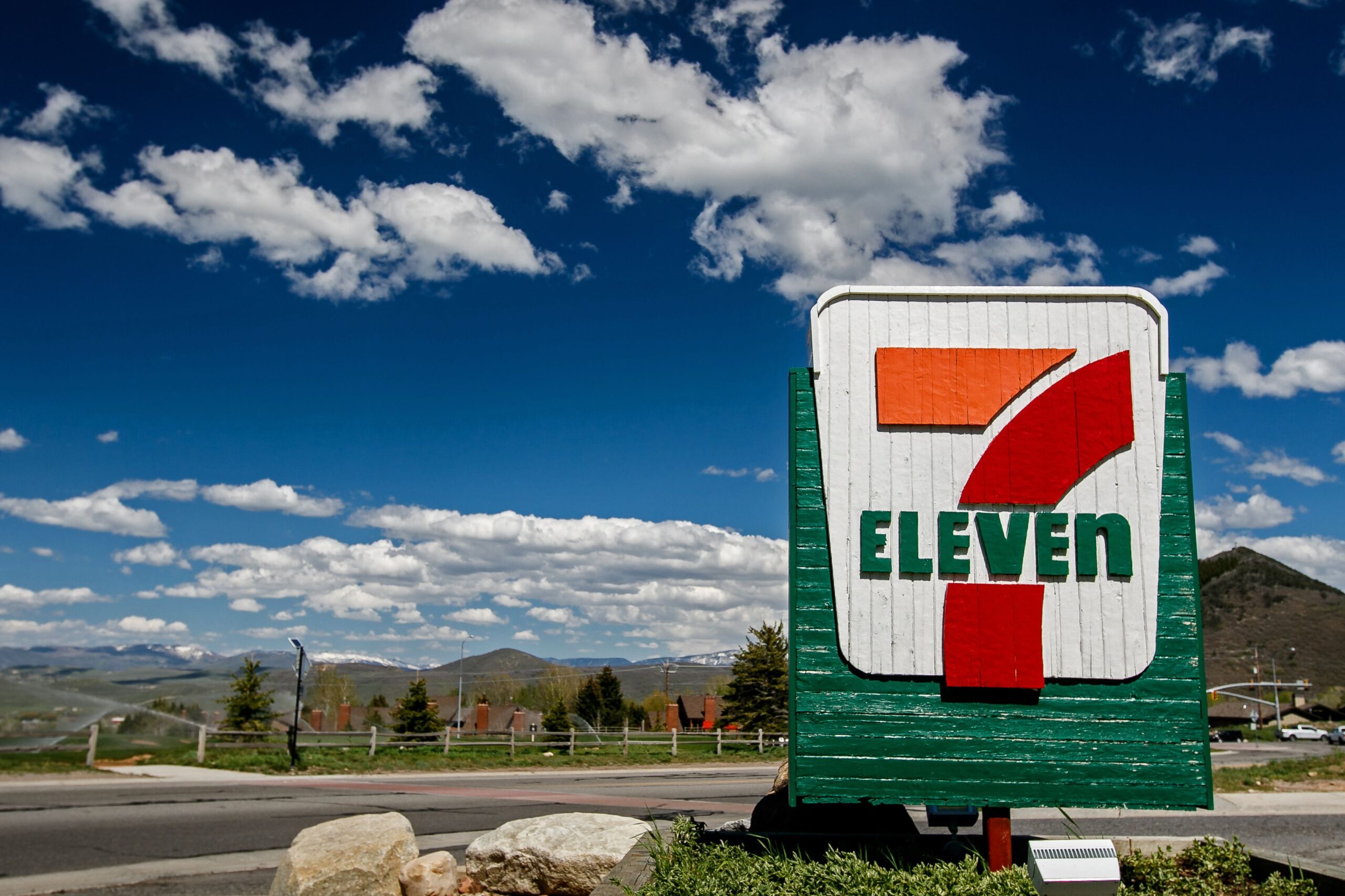 Park City, UT, May 12, 2017: 7-Eleven sign against a picturesque landscape is brightly lit by the sun.