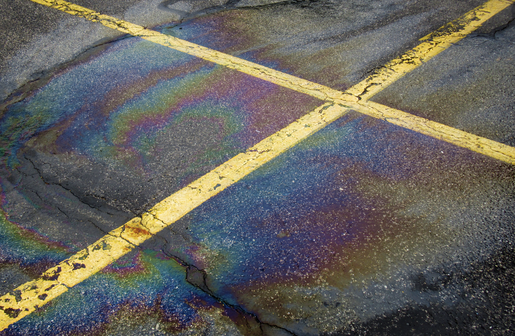 Leaked oil on pavement