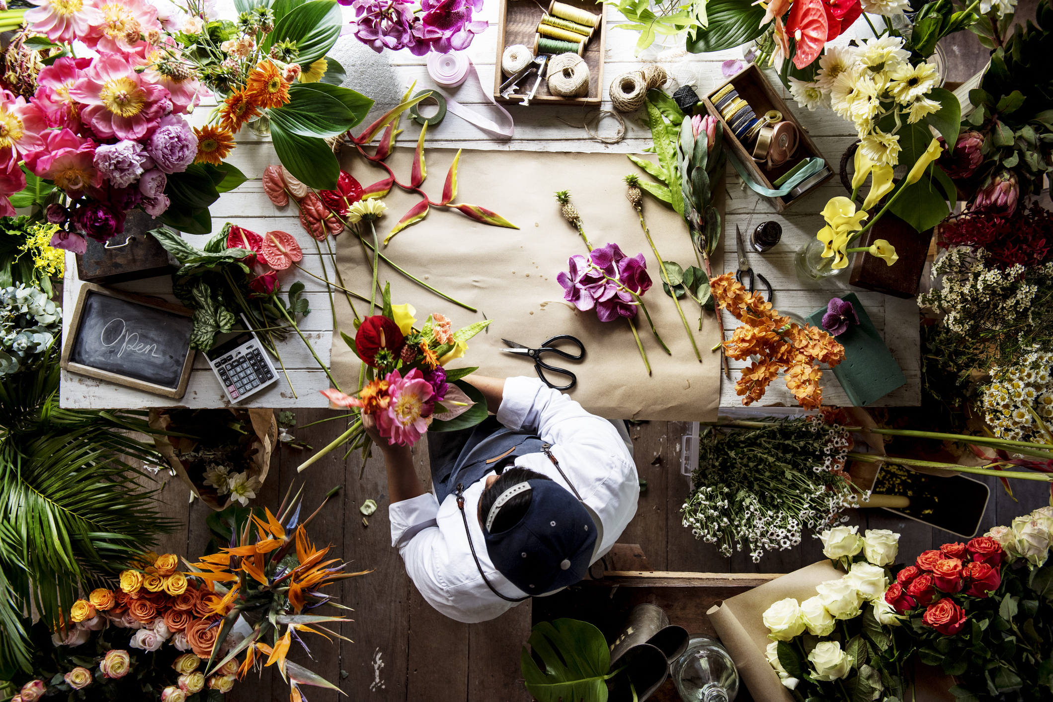 Top-View of Florist Working on Flower Arrangement