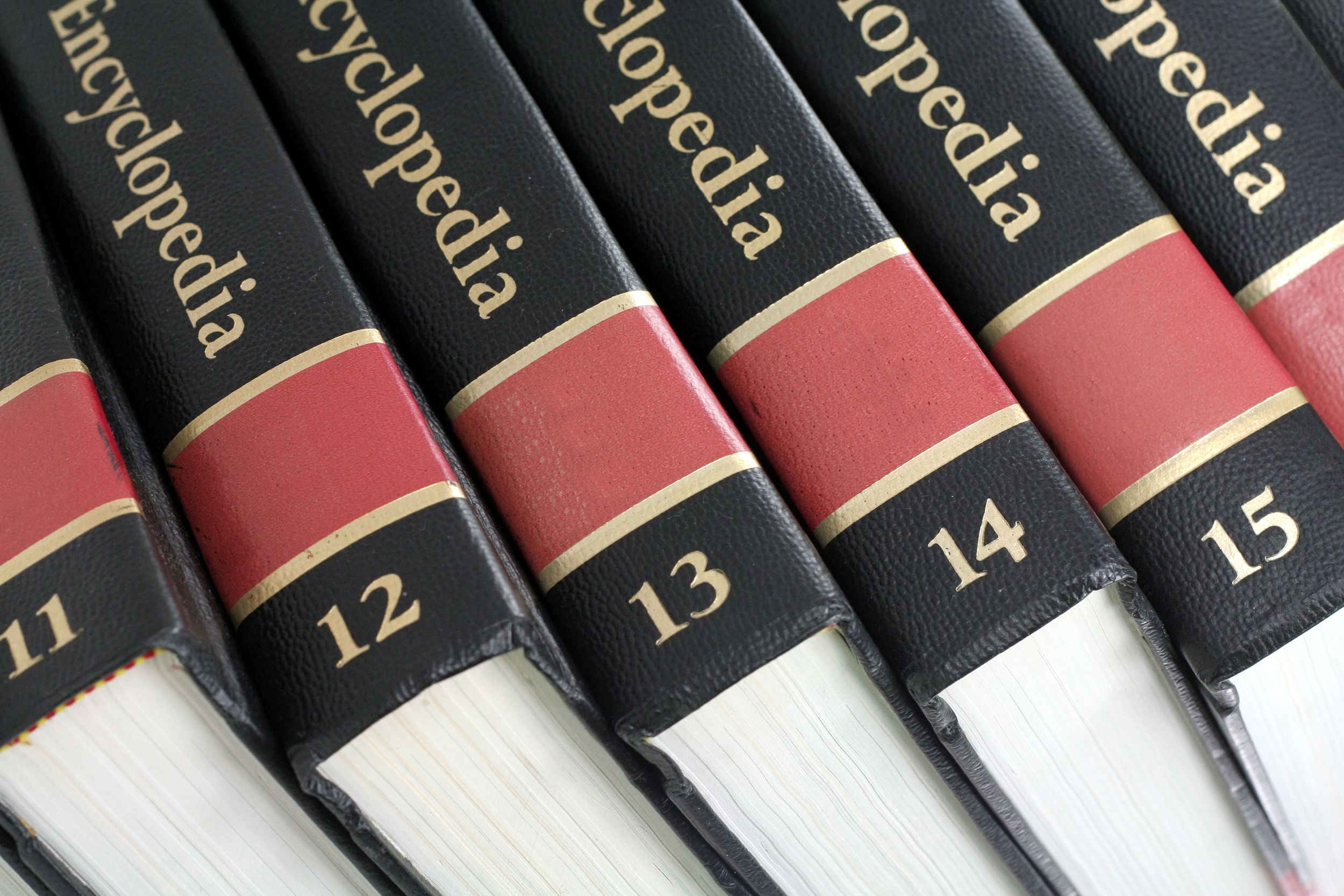 Closeup of a stack of encyclopedias from 11 to 16 in a slight diagonal