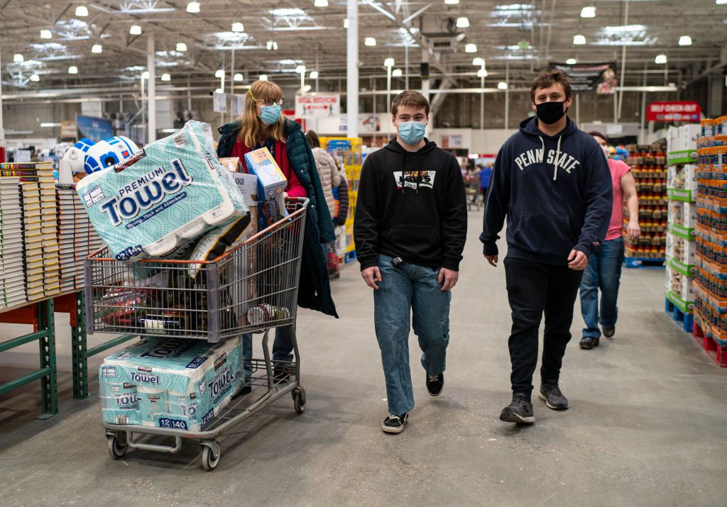 Shoppers wearing masks search for items at a Costco Wholesale store