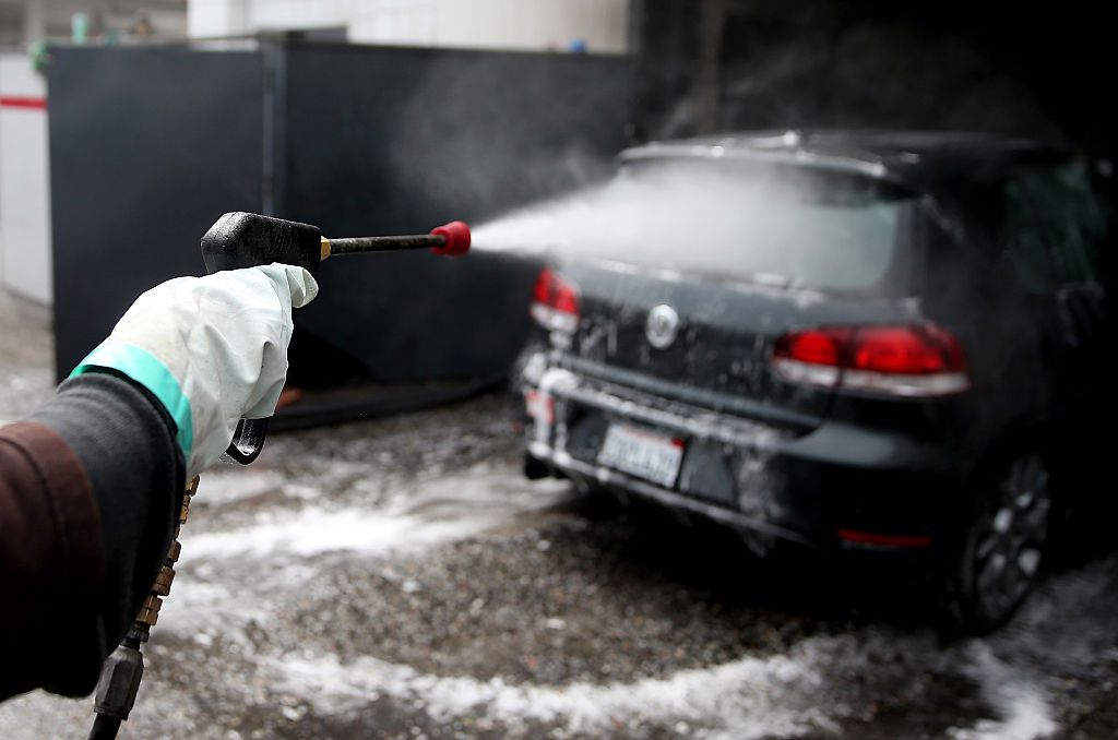 Arm washing a car