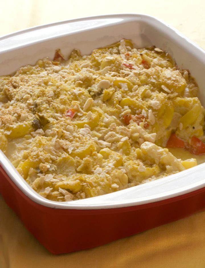 Summer Squash Casserole in a red ceramic baking dish