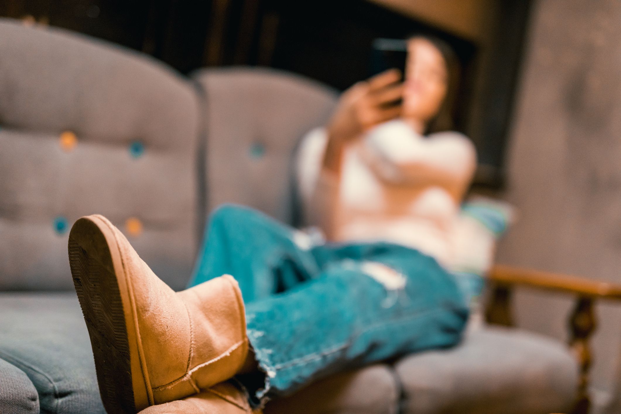 Beautiful young woman using phone in a downtown café