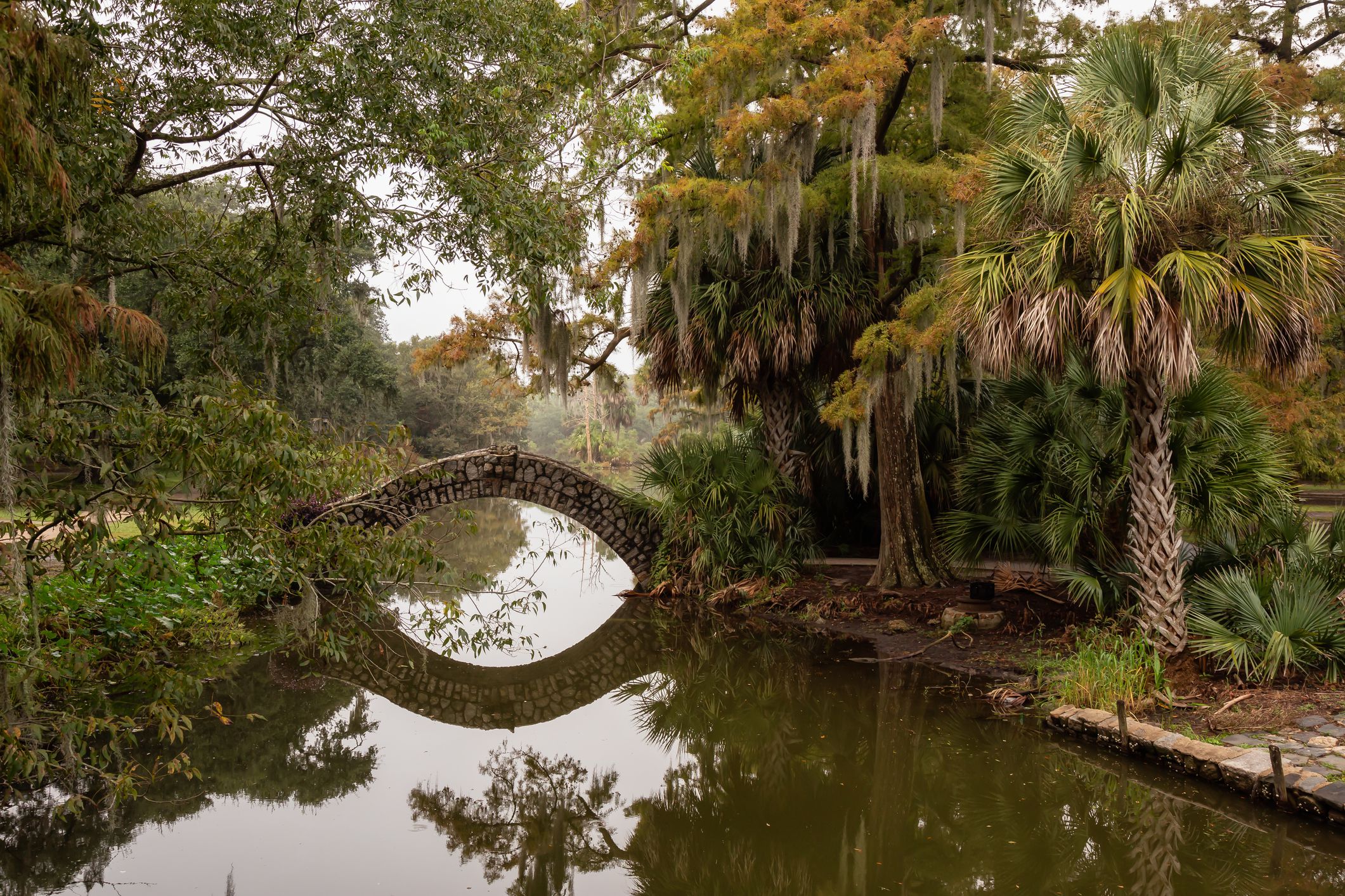 Bridge over a river duing a foggy morning. Taken in City Park, New Orleans, Louisiana, United States.