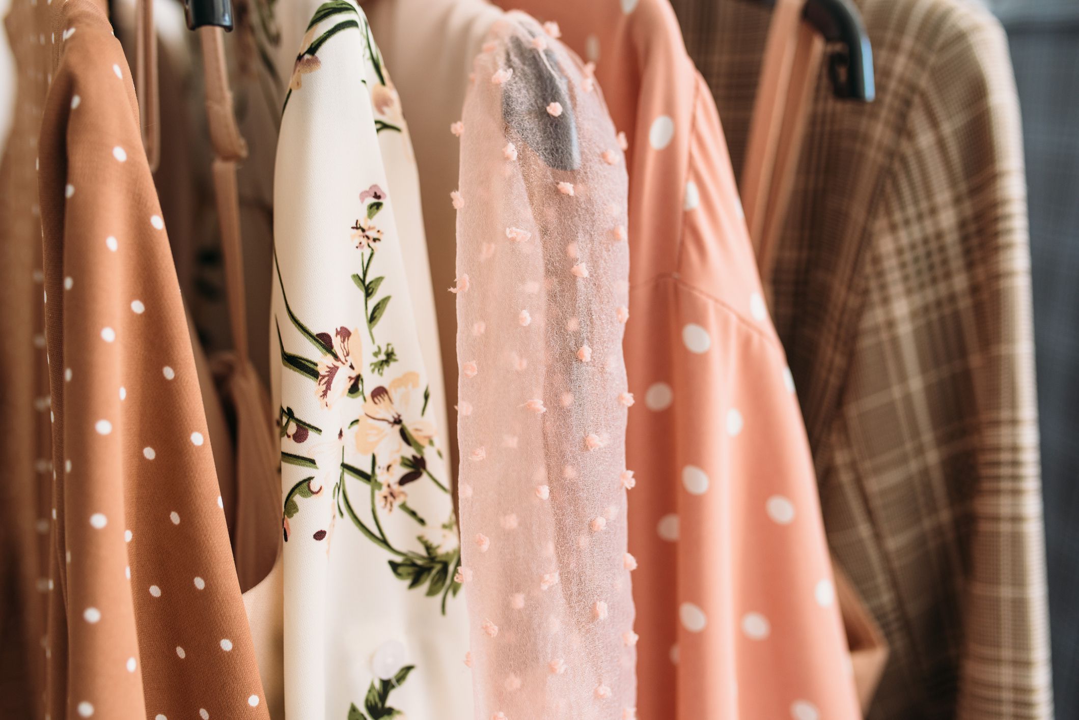 Capsule clothes in beige and pink colors closeup textures.