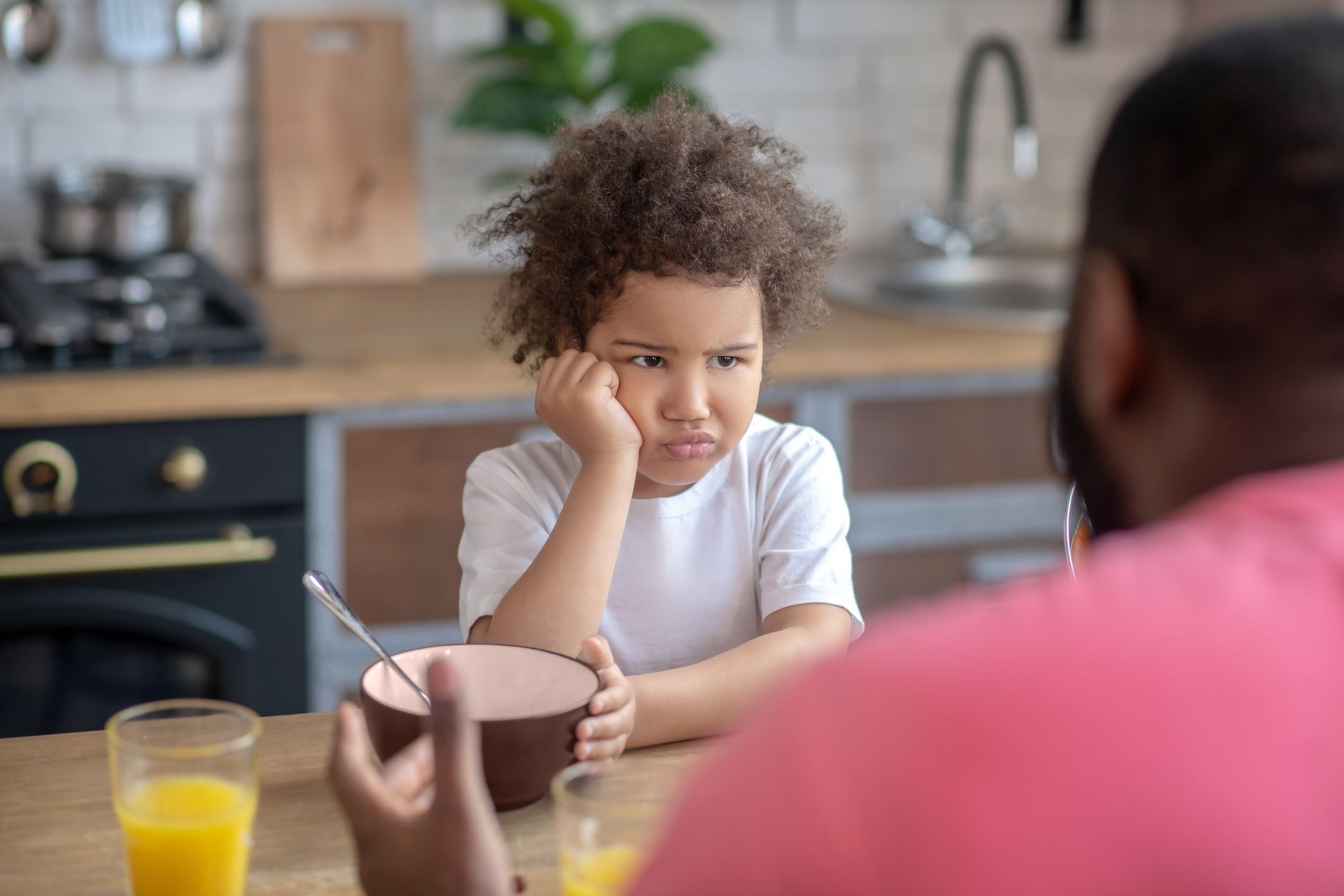 Dont want to eat. Cute little kid looking sad not wanting to eat